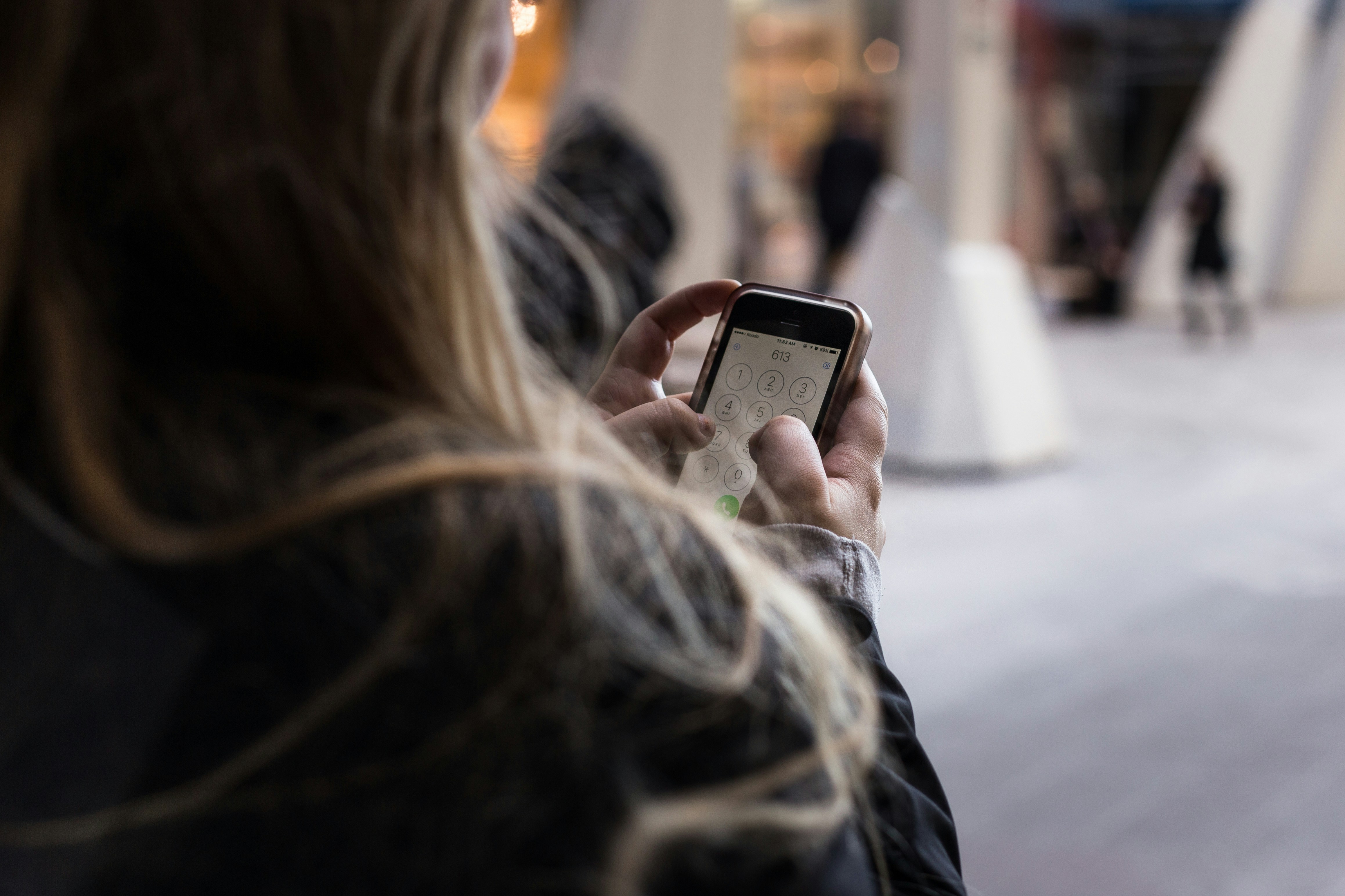 Woman Using Mobile - WellSaid Labs Alternative