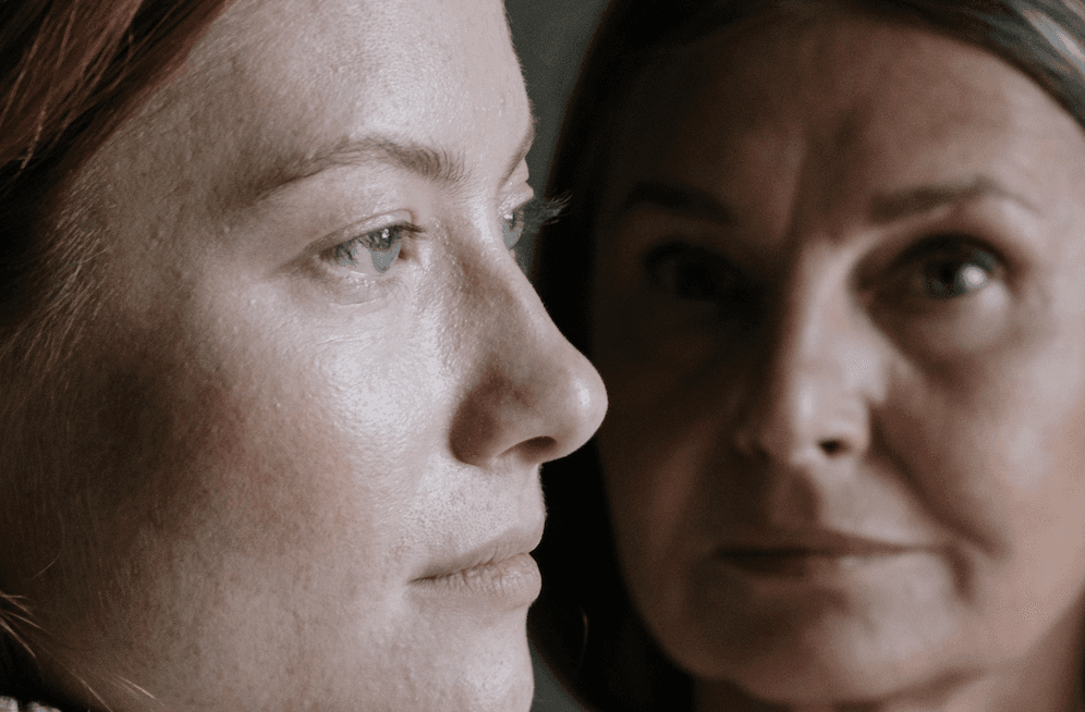 Conversion Truth for Families - Mother looking at camera, adult daughter's profile from the side