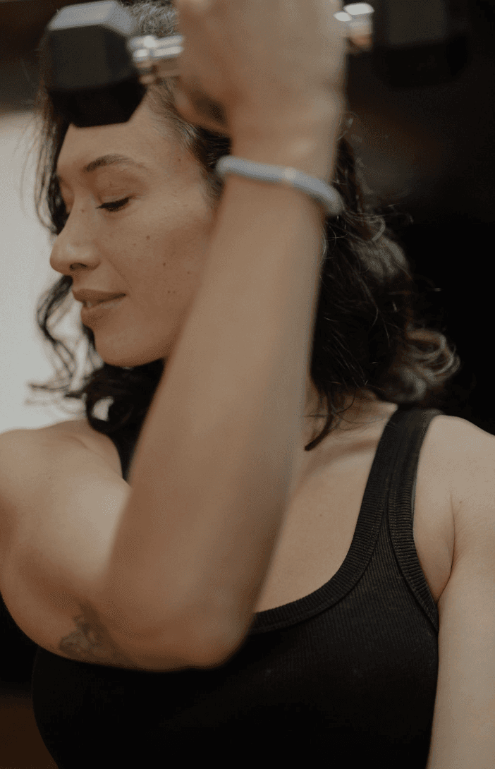 Black cosmetic product bottle against a dark background