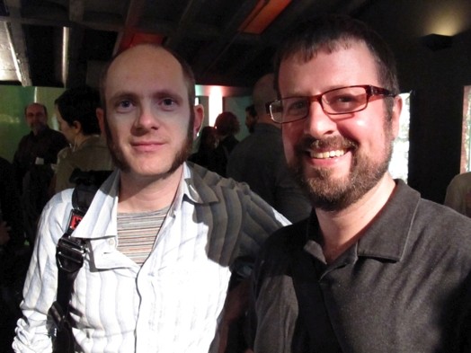 two young men smiling at the camera