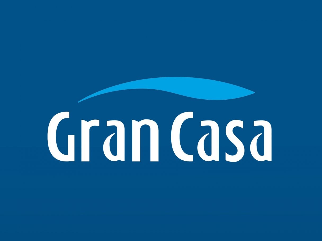 Rustic cabin in a golden field at sunset