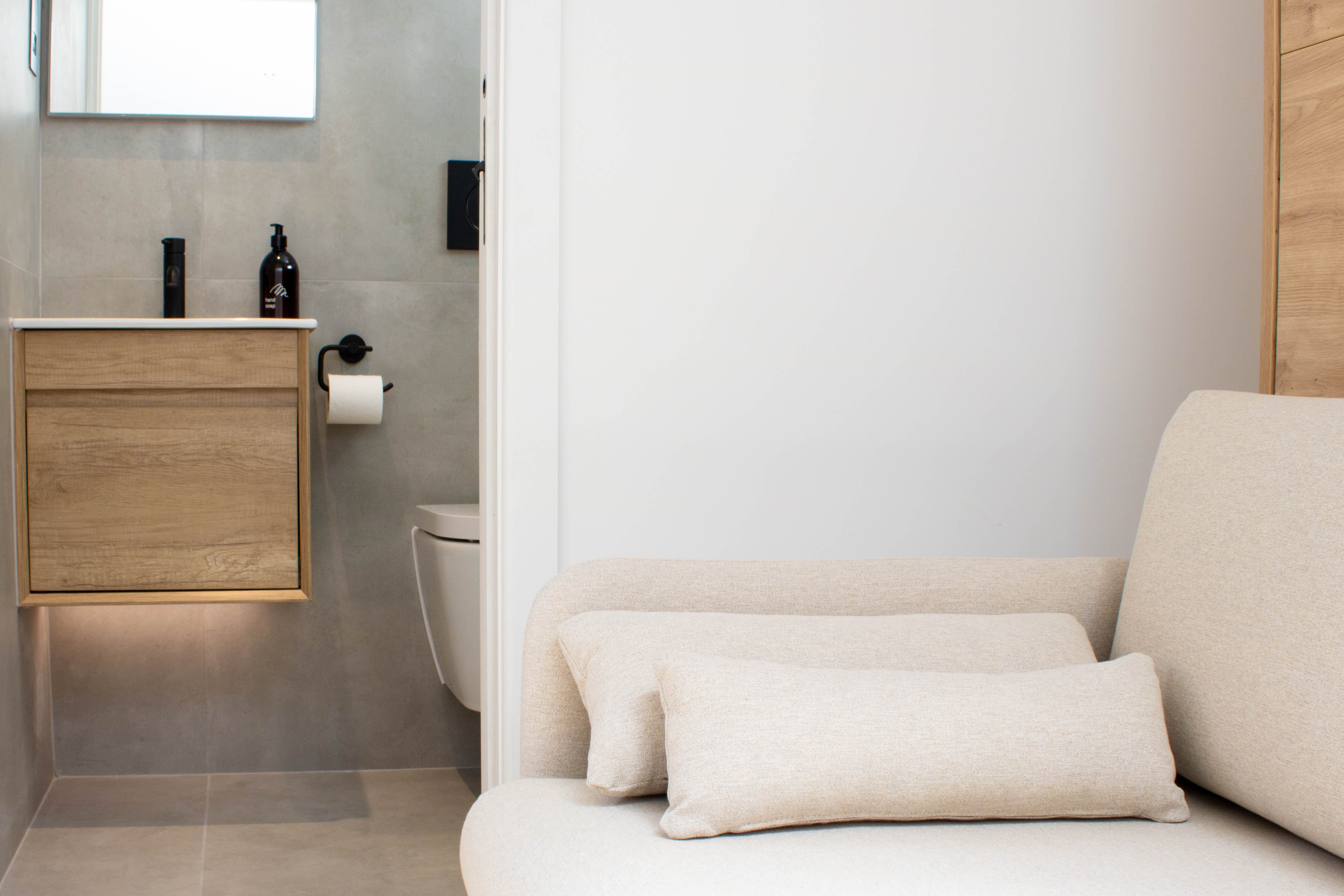 Minimalist, Nordic inspired bathroom in suite with under-sink lighting