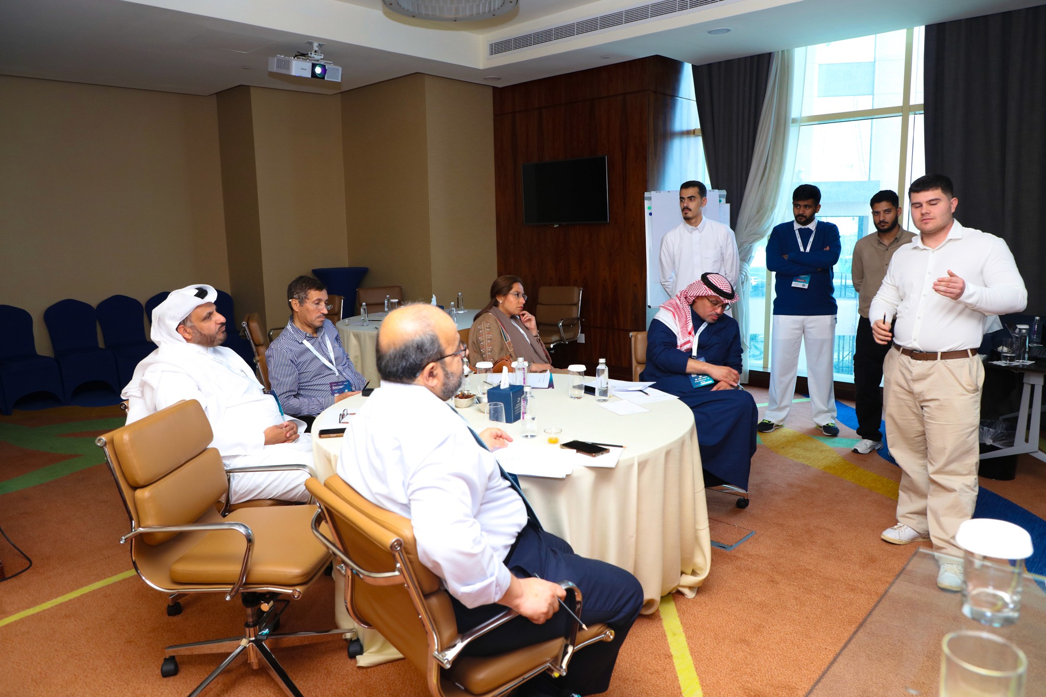 A Man Talking using Microphone in the Conference Room