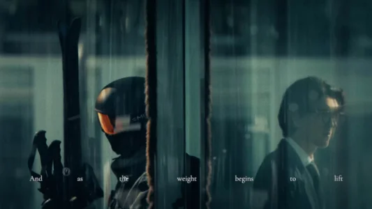 A man walking through a corporate building in ski gear