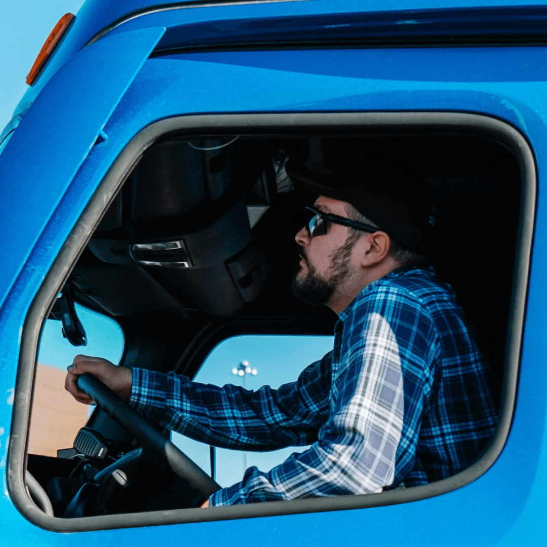 Truck driver approaching warehouse dock after completing digital driver check-in workflow