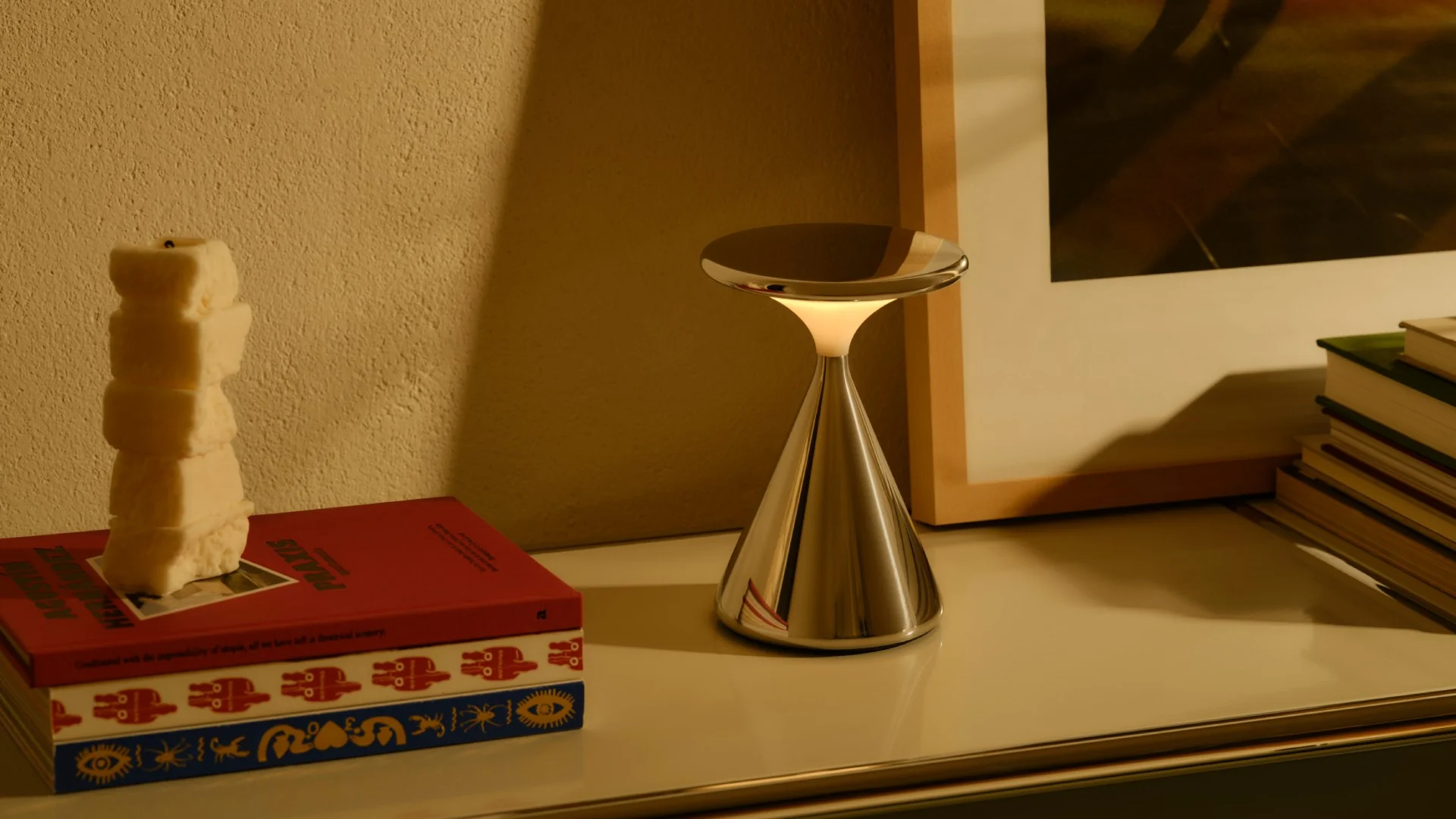 GRAU Salt cordless table lamp in polished aluminium, with a touch dimmed head