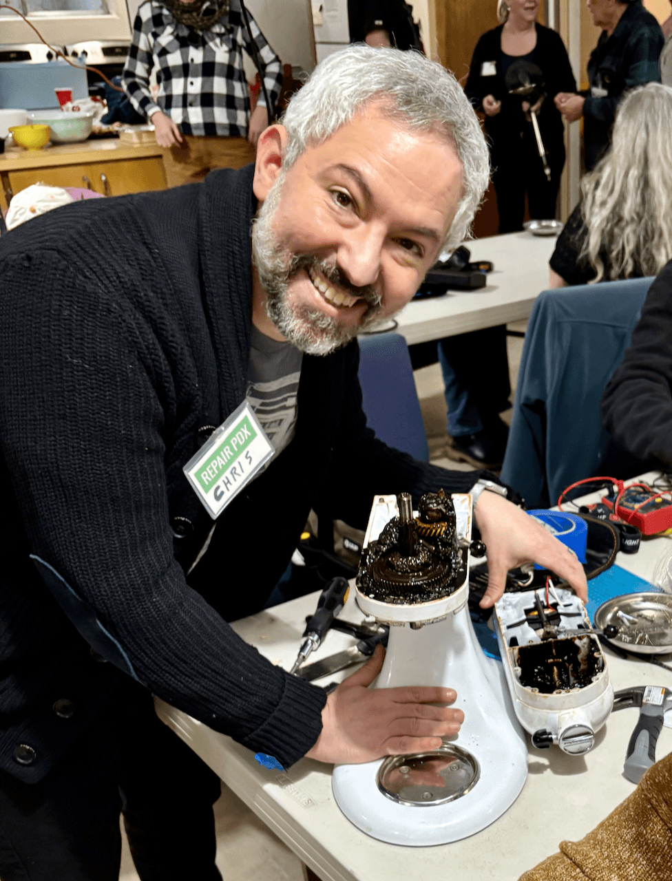 Chris repairing a KitchenAid stand mixer