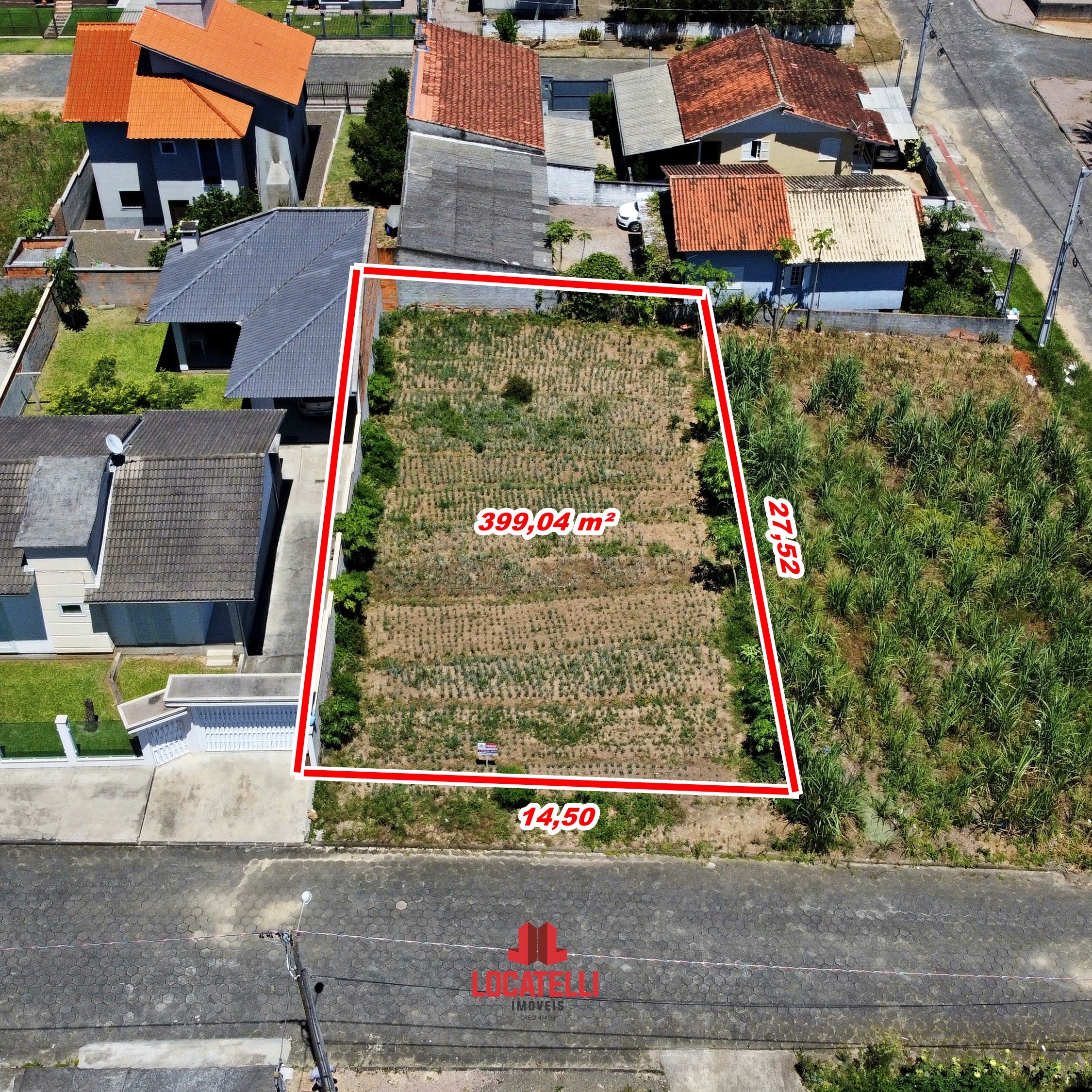 A modern brick house with a two-car garage, well-manicured lawn, and clear blue sky in the background.