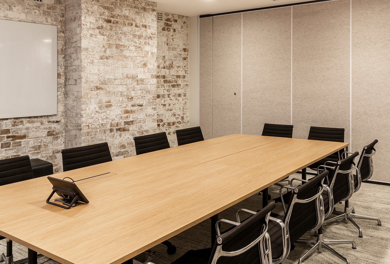 Photo of board room with long table and many chairs