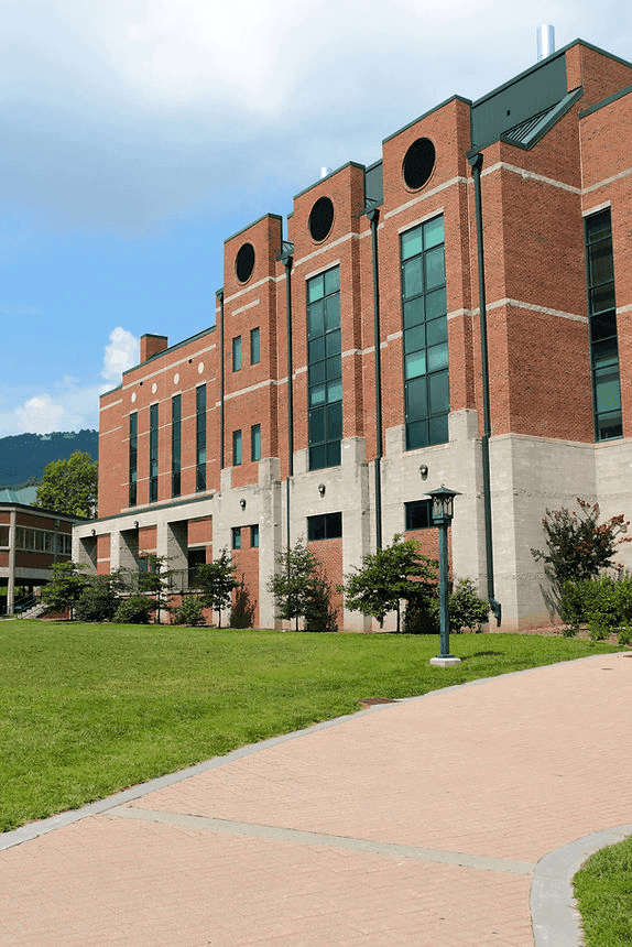 man checking a fire extinguisher