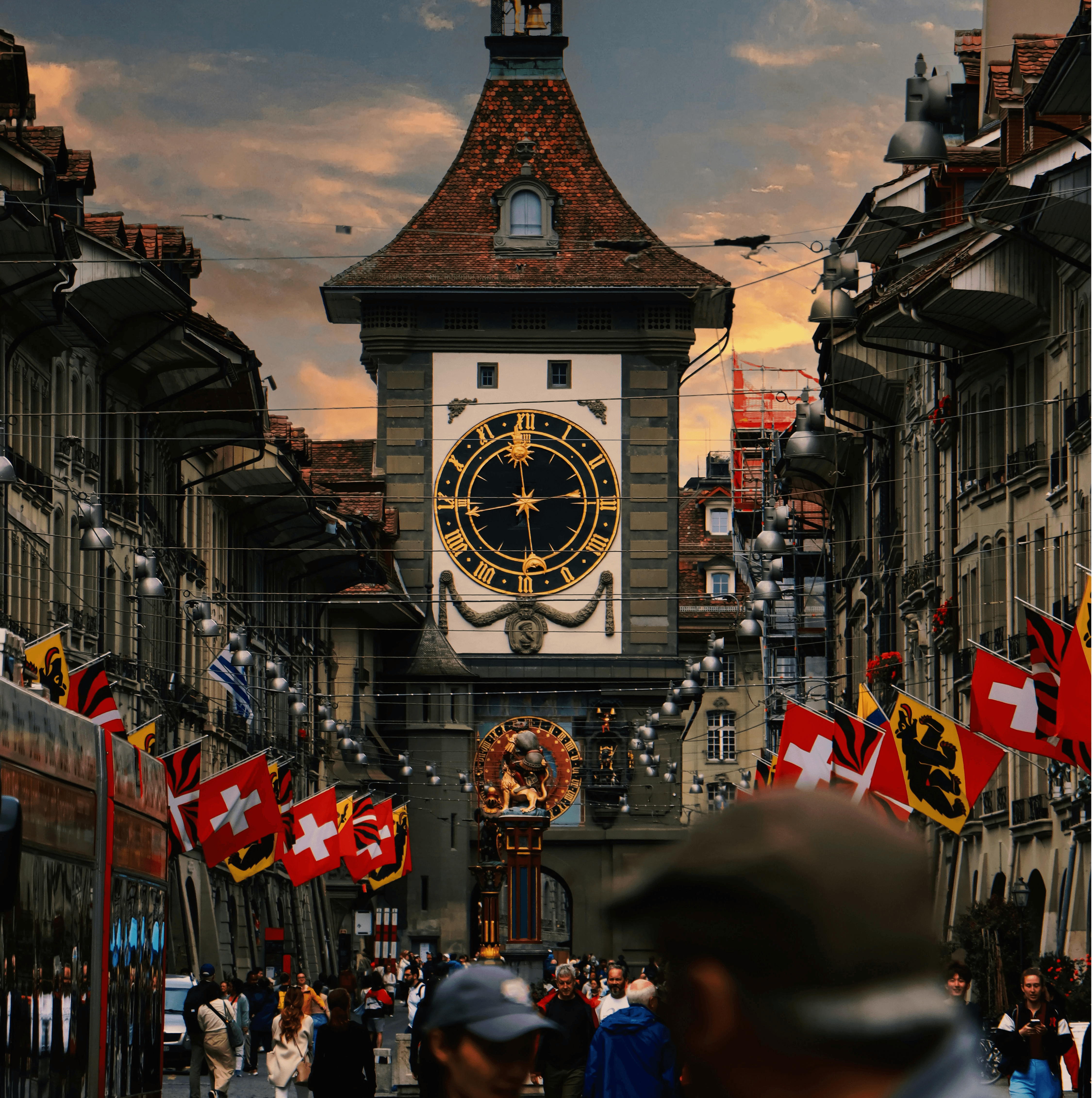 A large clock tower towering over a city street