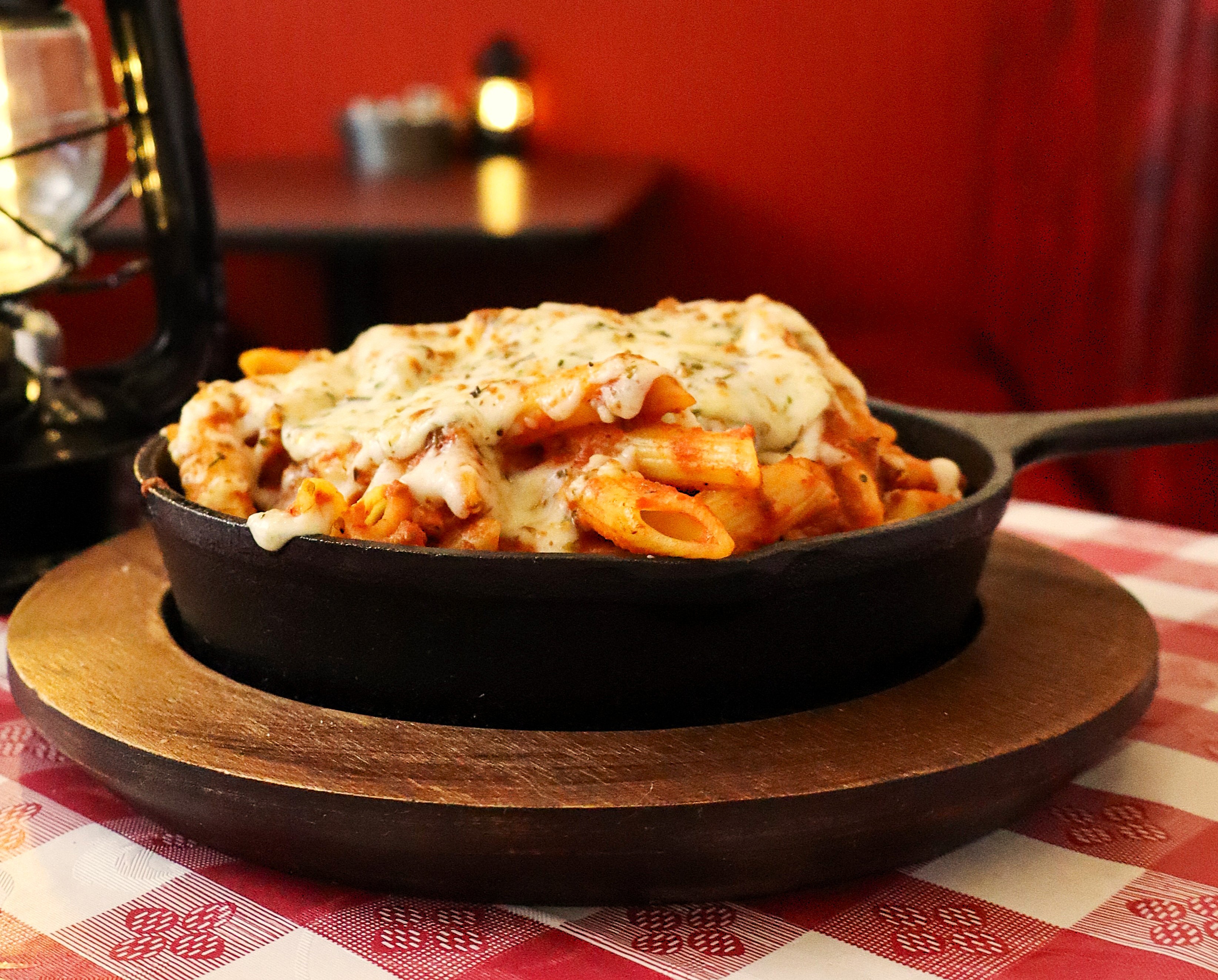 a bowl of pasta noodles with an alfredo sauce