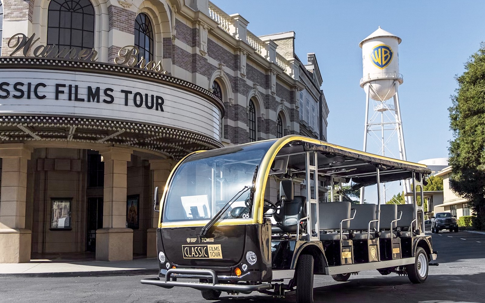 Warner Bros. Studio tour tram in front of Classic Films Tour entrance, Hollywood.