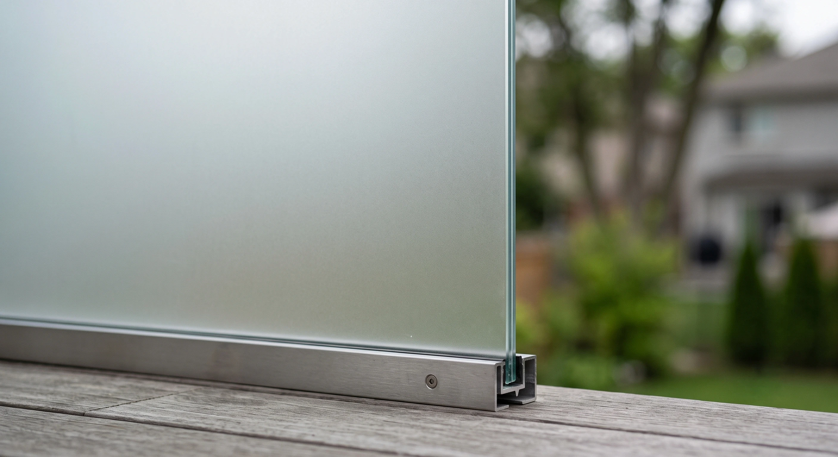 Close view of a satin frosted glass guard panel showing even light diffusion