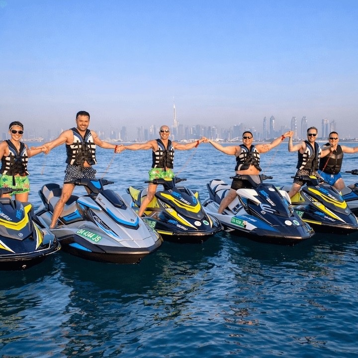 Jet ski rentals in Dubai with riders holding hands