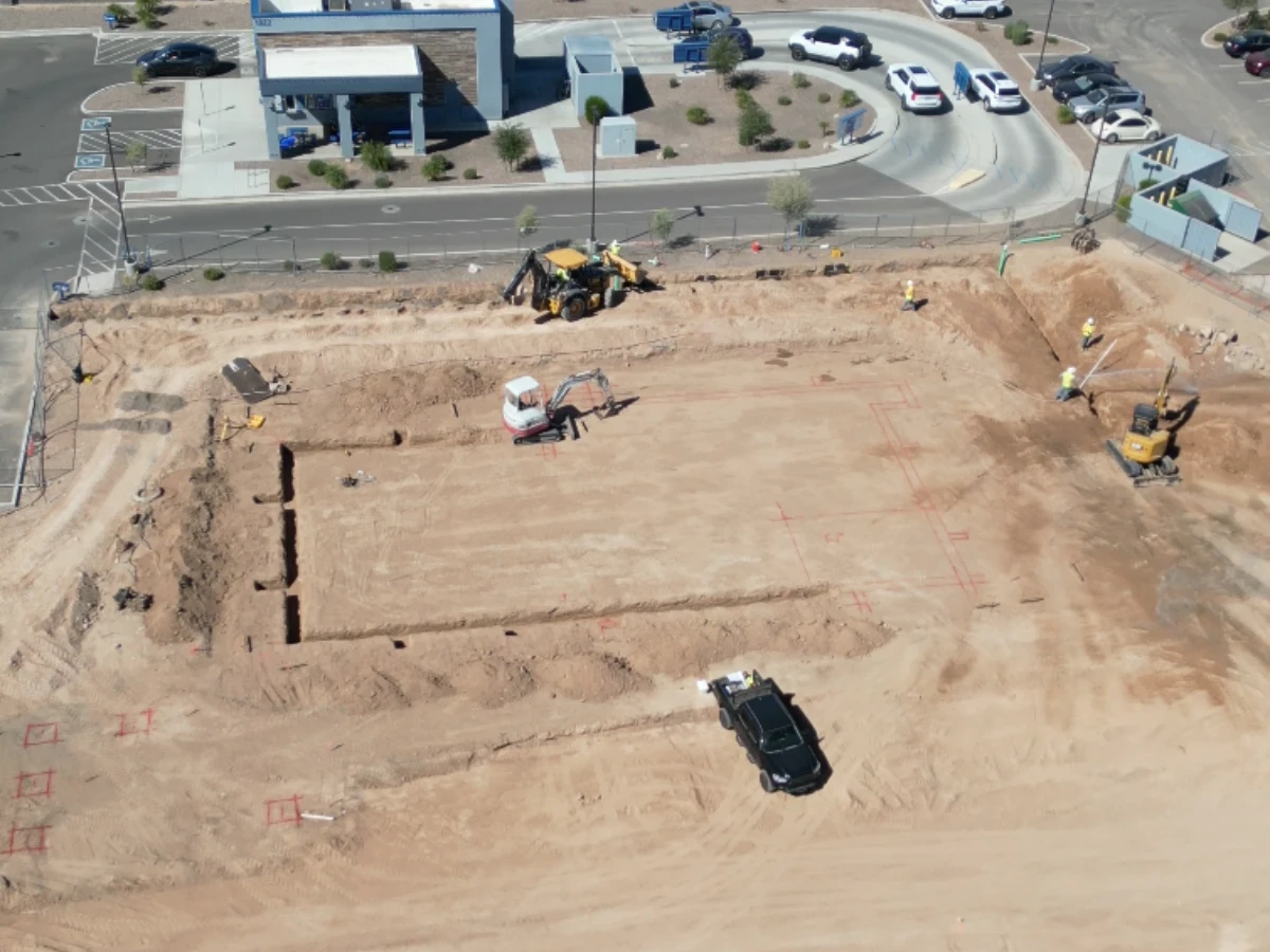 Finished Culver's building pad with foundation footings being dug