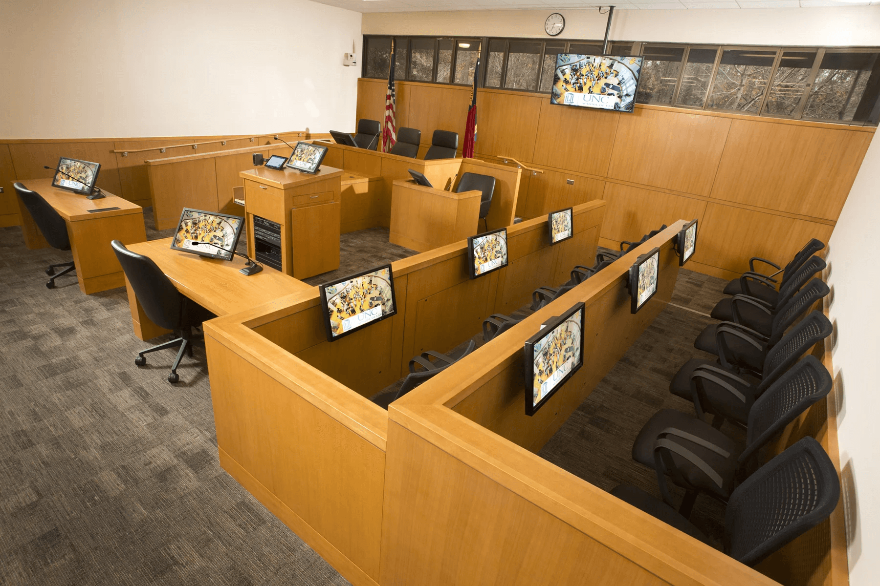 people sitting on chairs watching a game