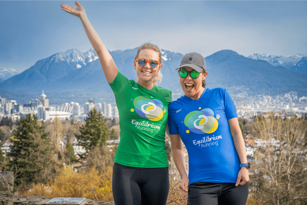 Coach Suenaga and a runner posing for a photo