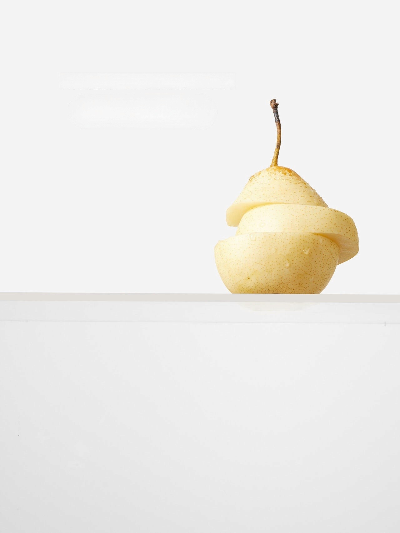 Creative spiral cut pear still life photography by Lefty Studio