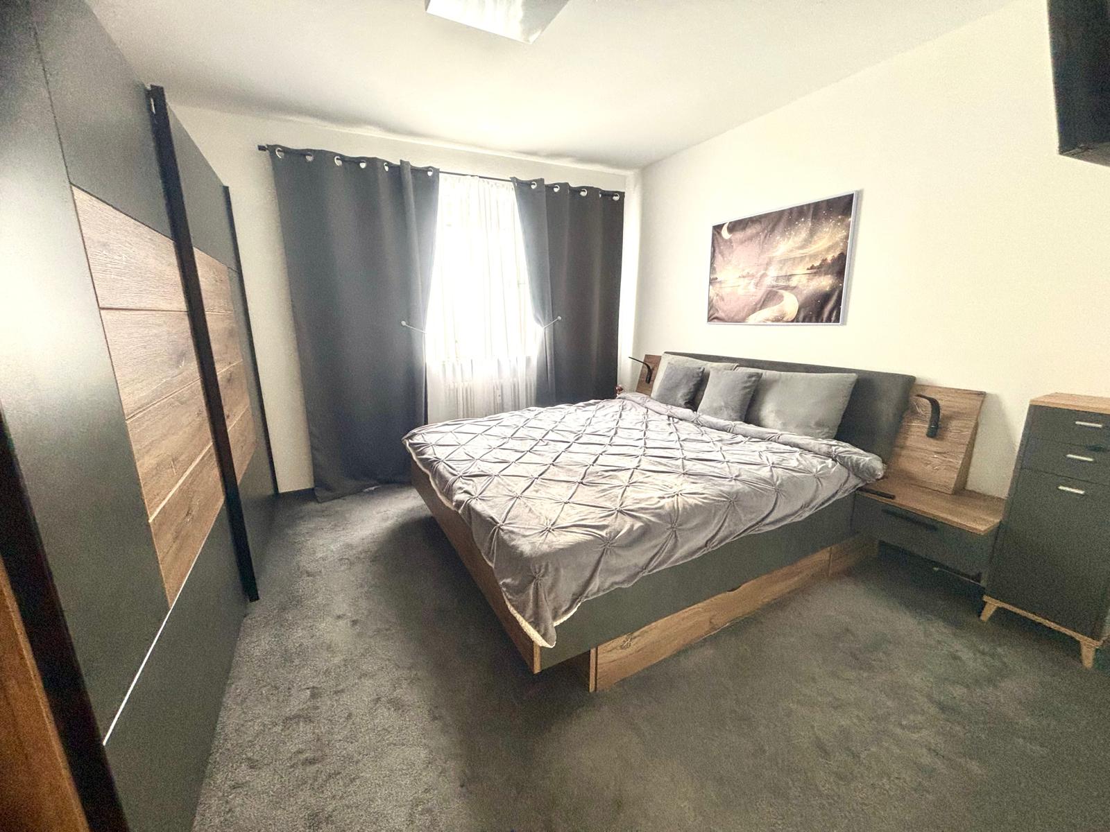 house interior with stairs and a tall window