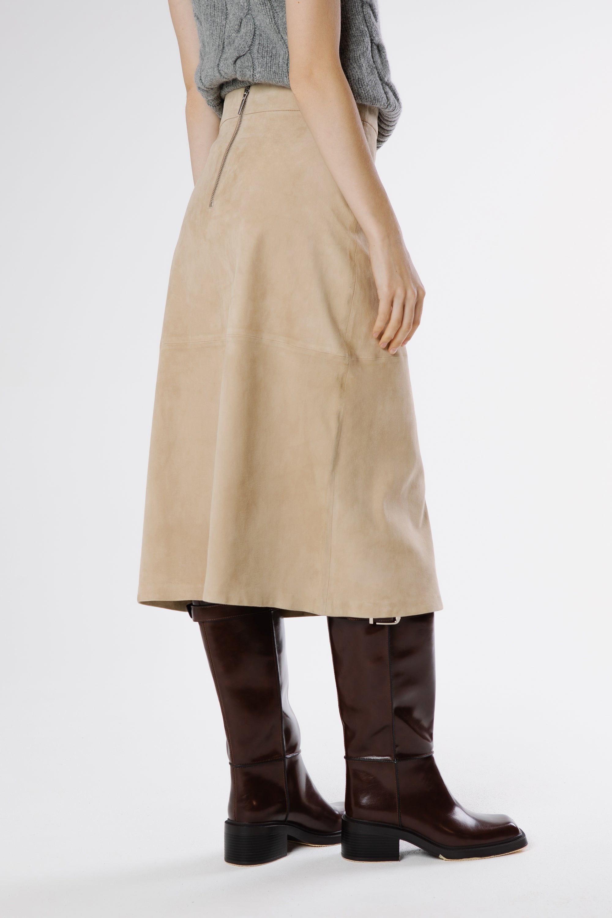 Back view of safari suede midi skirt highlighting minimal design and refined straight cut