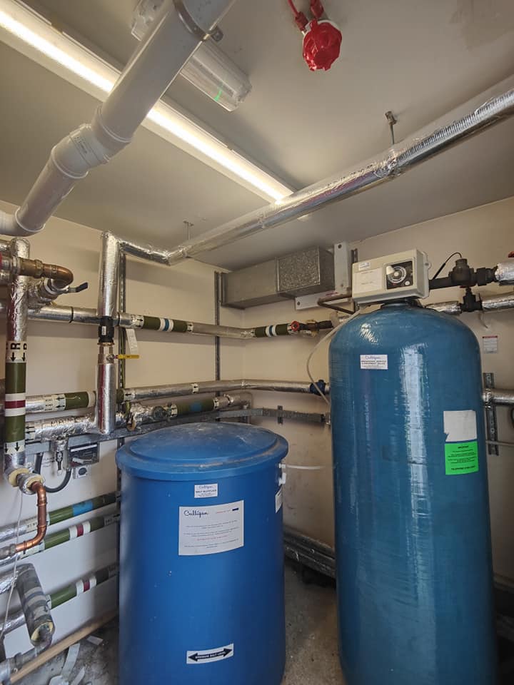 Certified gas engineer working on a commercial heating system