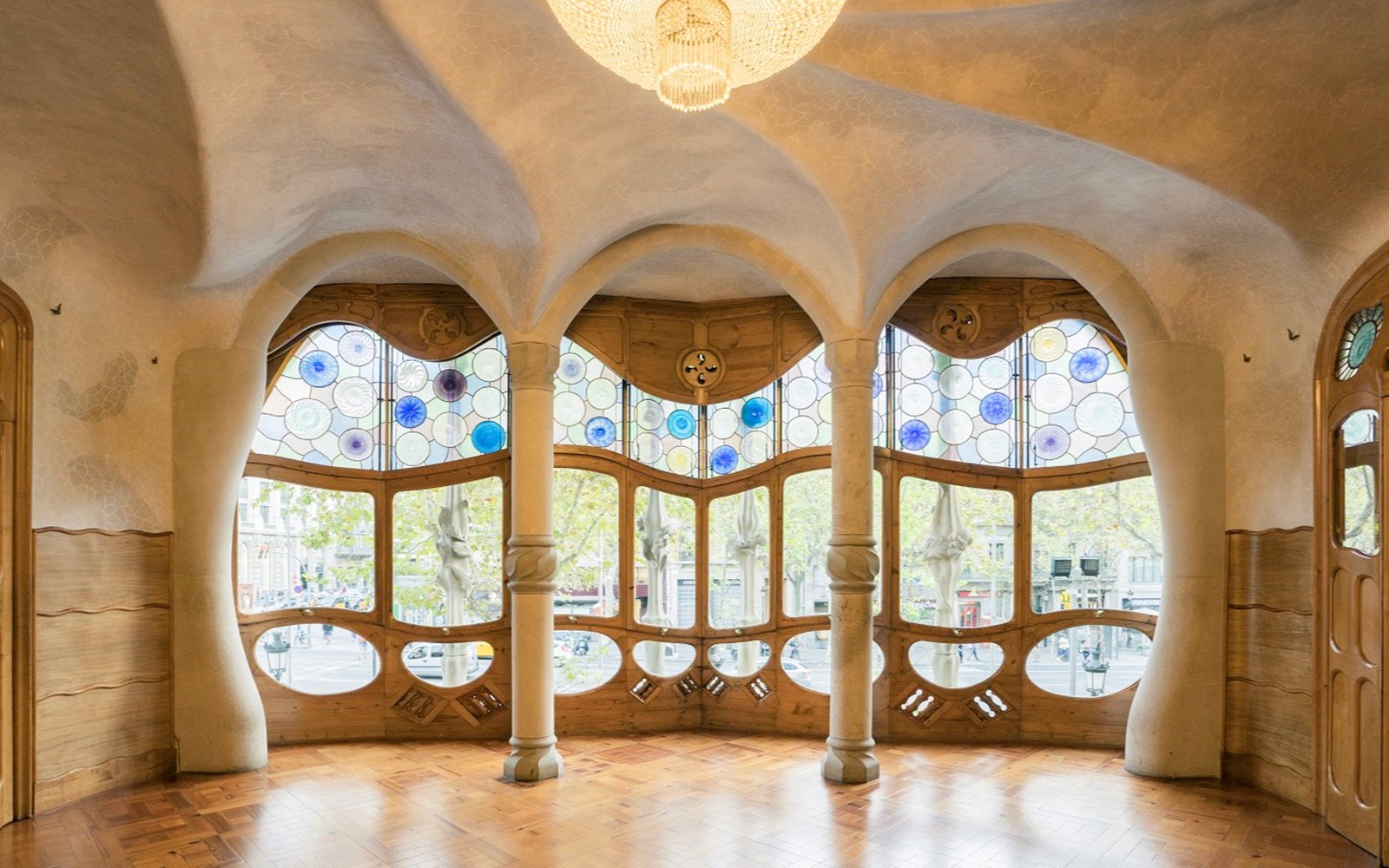 Casa Batlló interior with stained glass windows and unique architectural design in Barcelona.