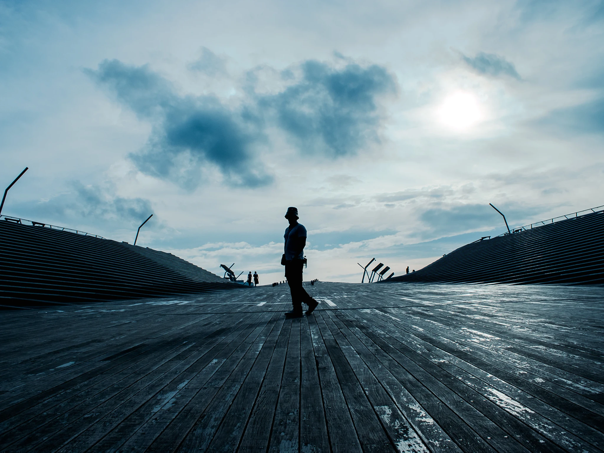 A man in the middle of a curved shape floor