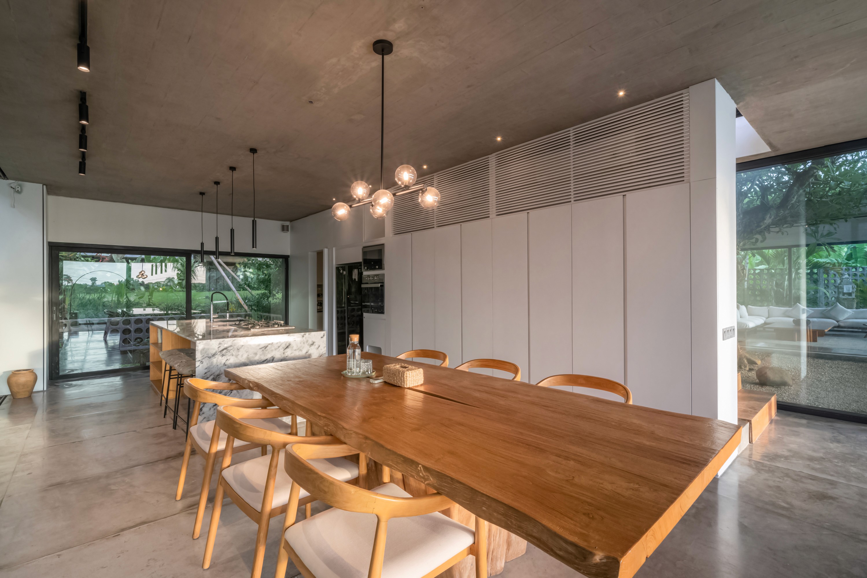 Modern kitchen island with bar chairs