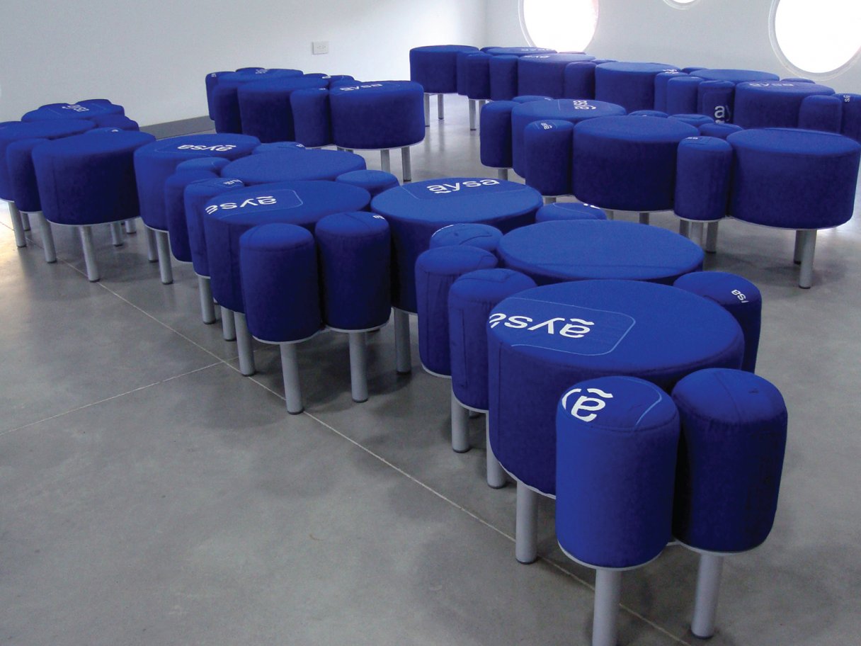 Rooftops of a coastal town with the sea in background