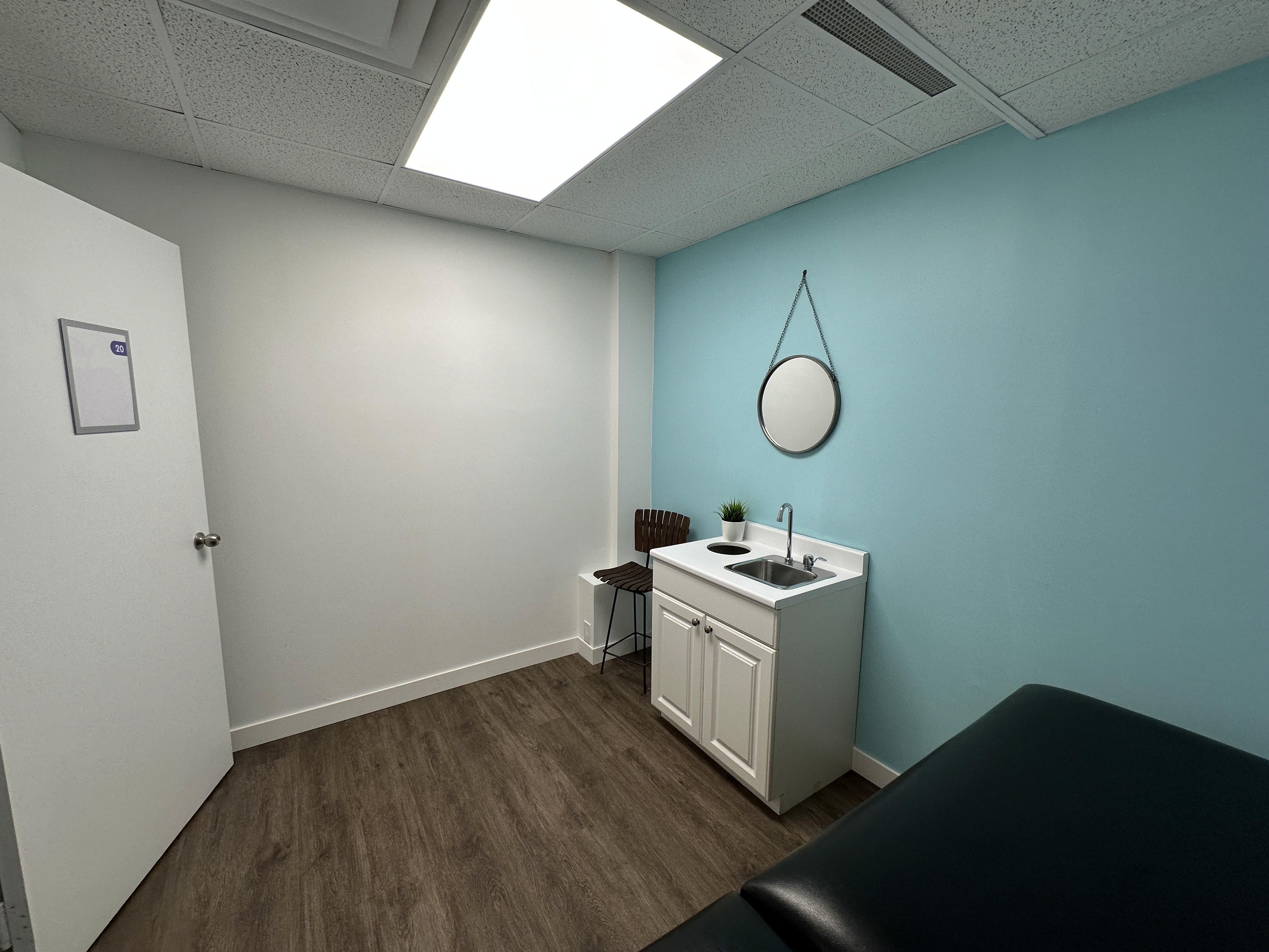 a doctor showing a patient something on the tablet