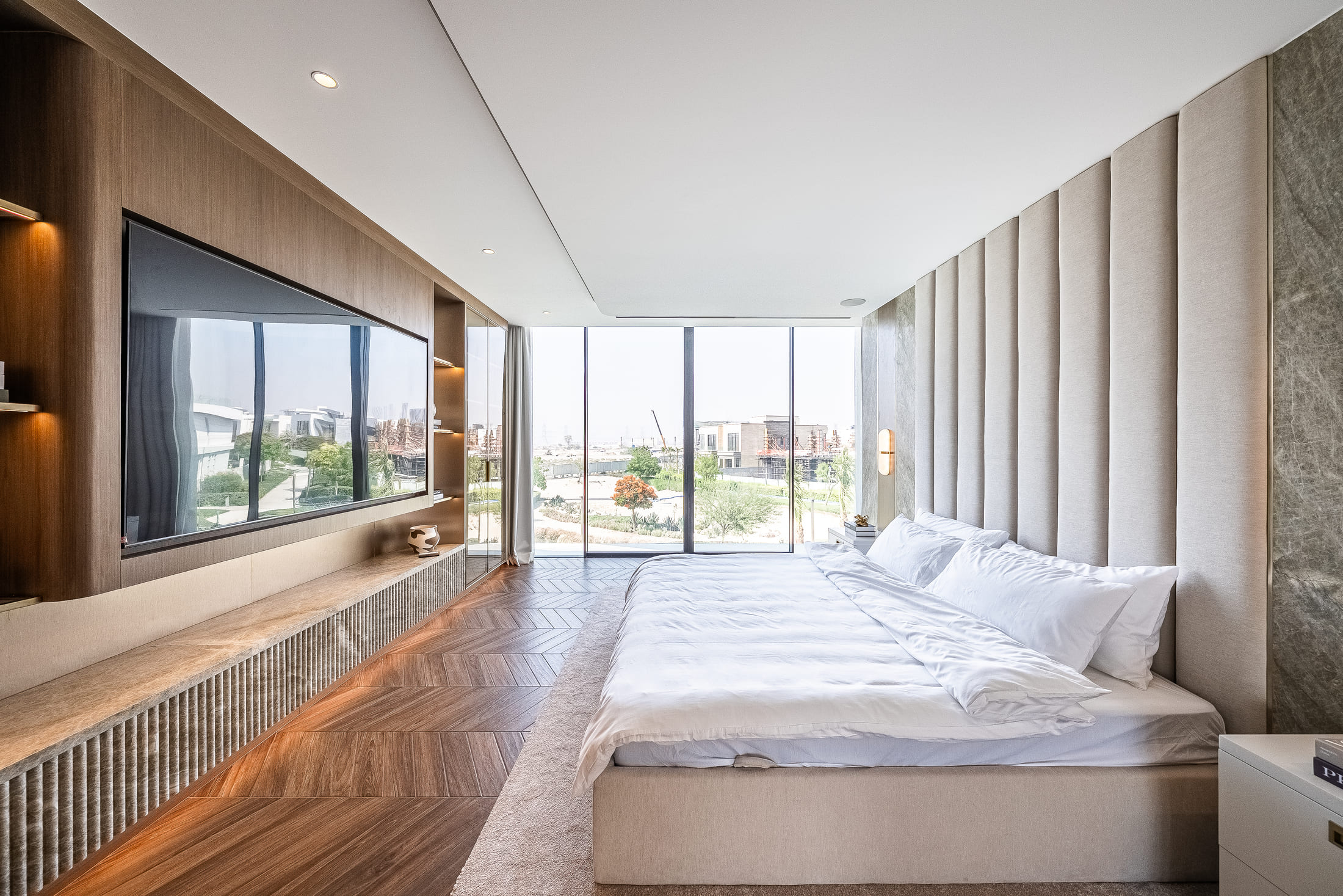 Image of a bedroom with a big glass window 