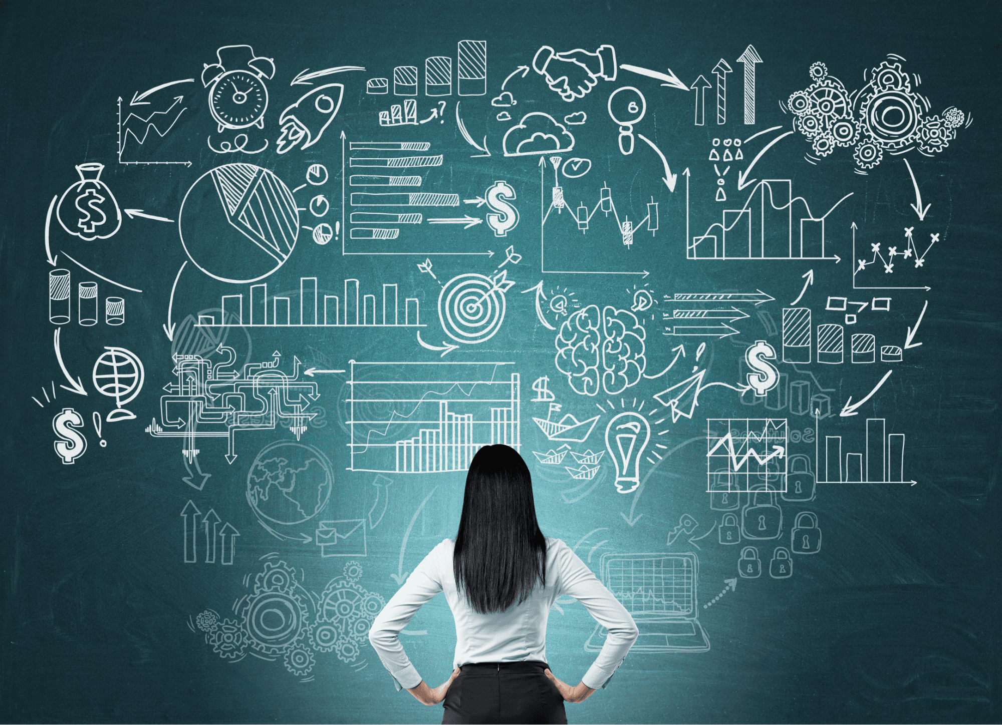 a group of people sitting around a table with laptops