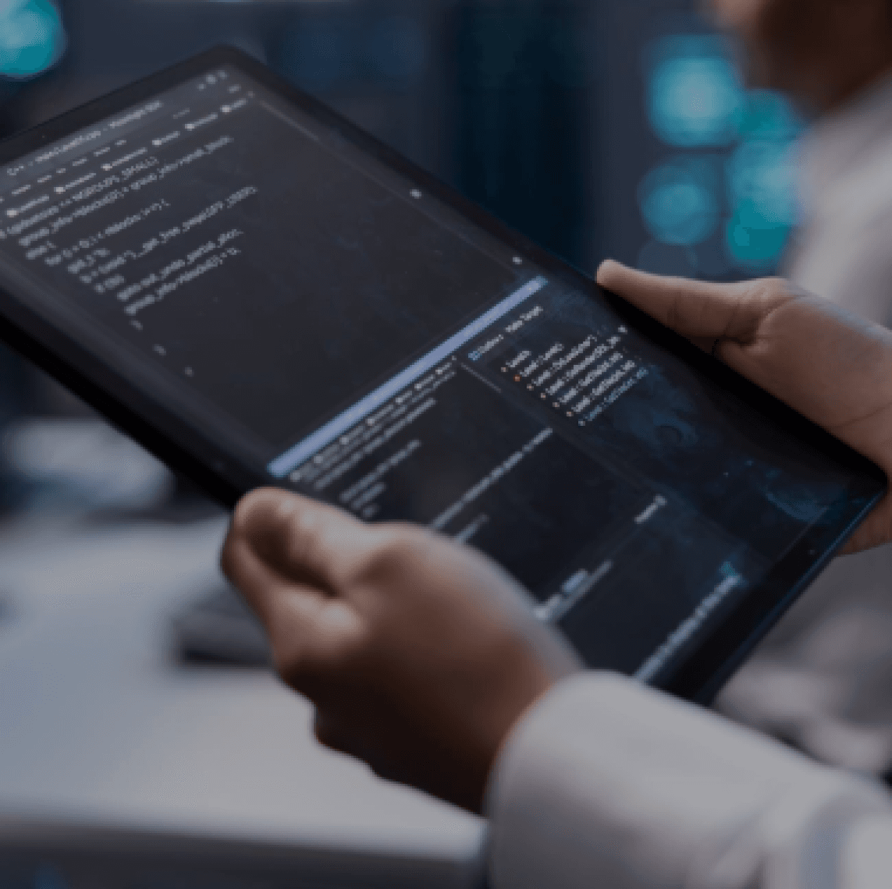 a Tech person holding a tab