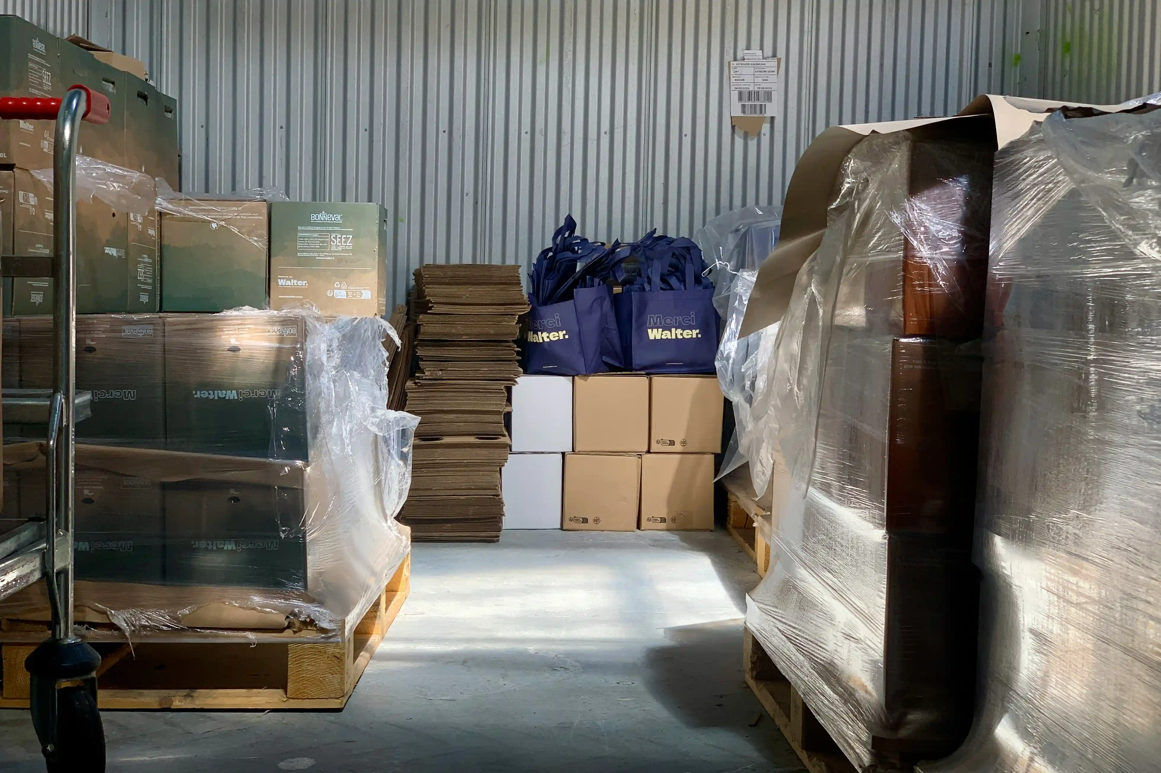 cluttered warehouse with boxes on pallets