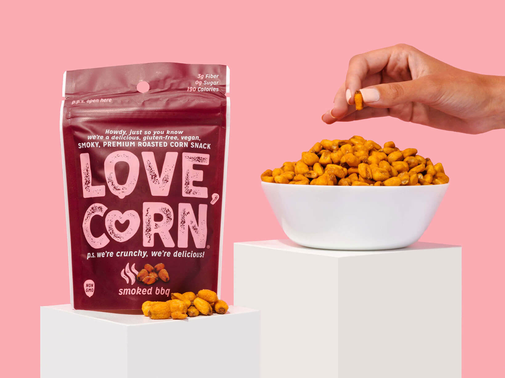 person holding purple and pink love corn