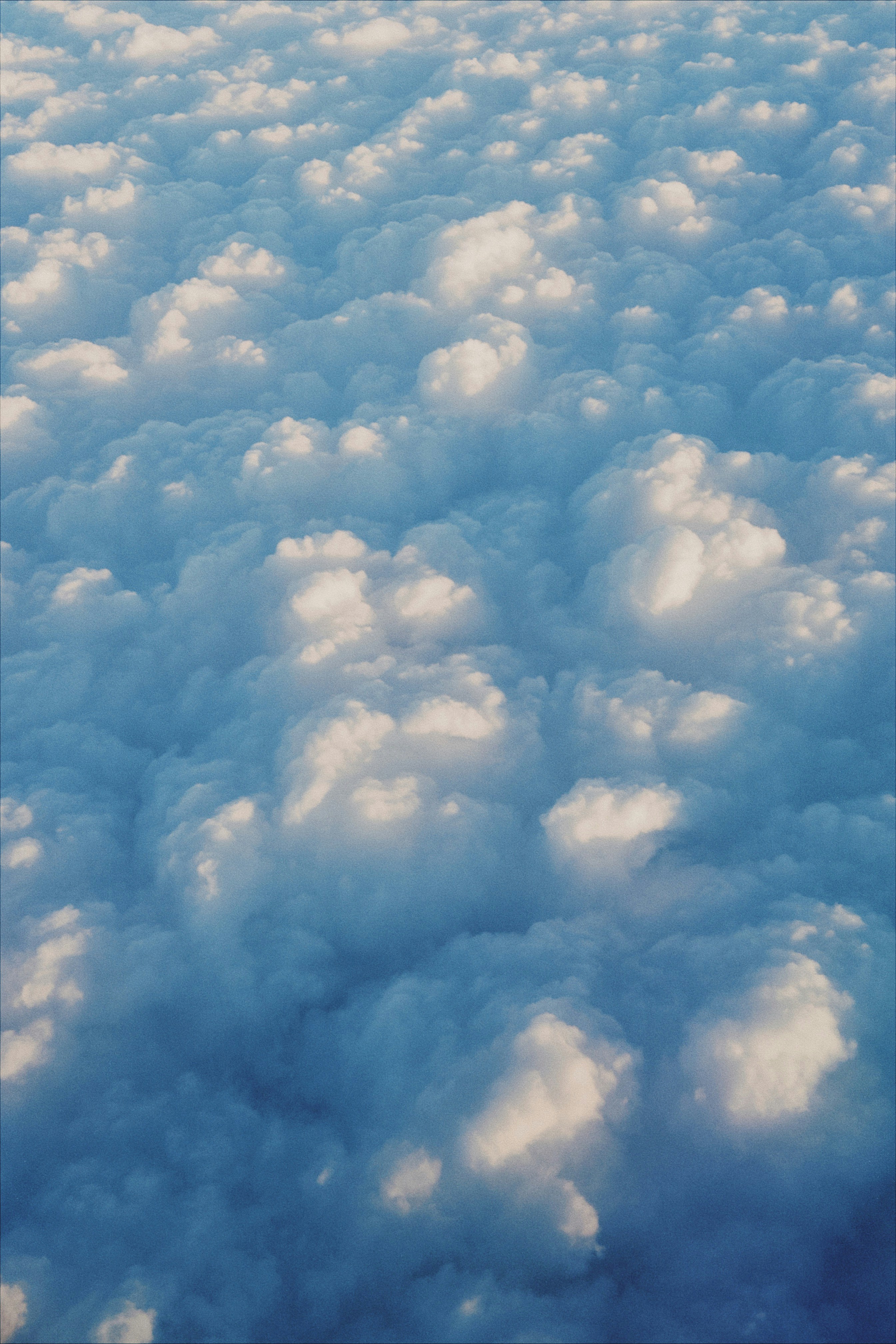 Fluffy white clouds seen from above on a clear day