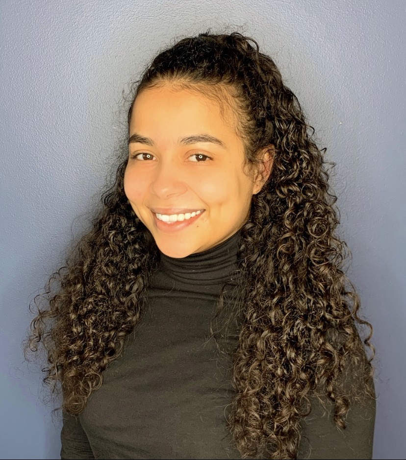 person writing on a piece of paper 