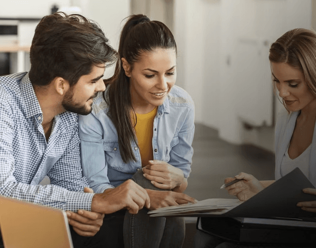 Team members in an office setting having a discussion, representing clear communication throughout the project process.