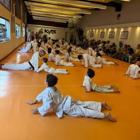 Coach guiding a martial arts student during striking training at Rai Martial Arts.