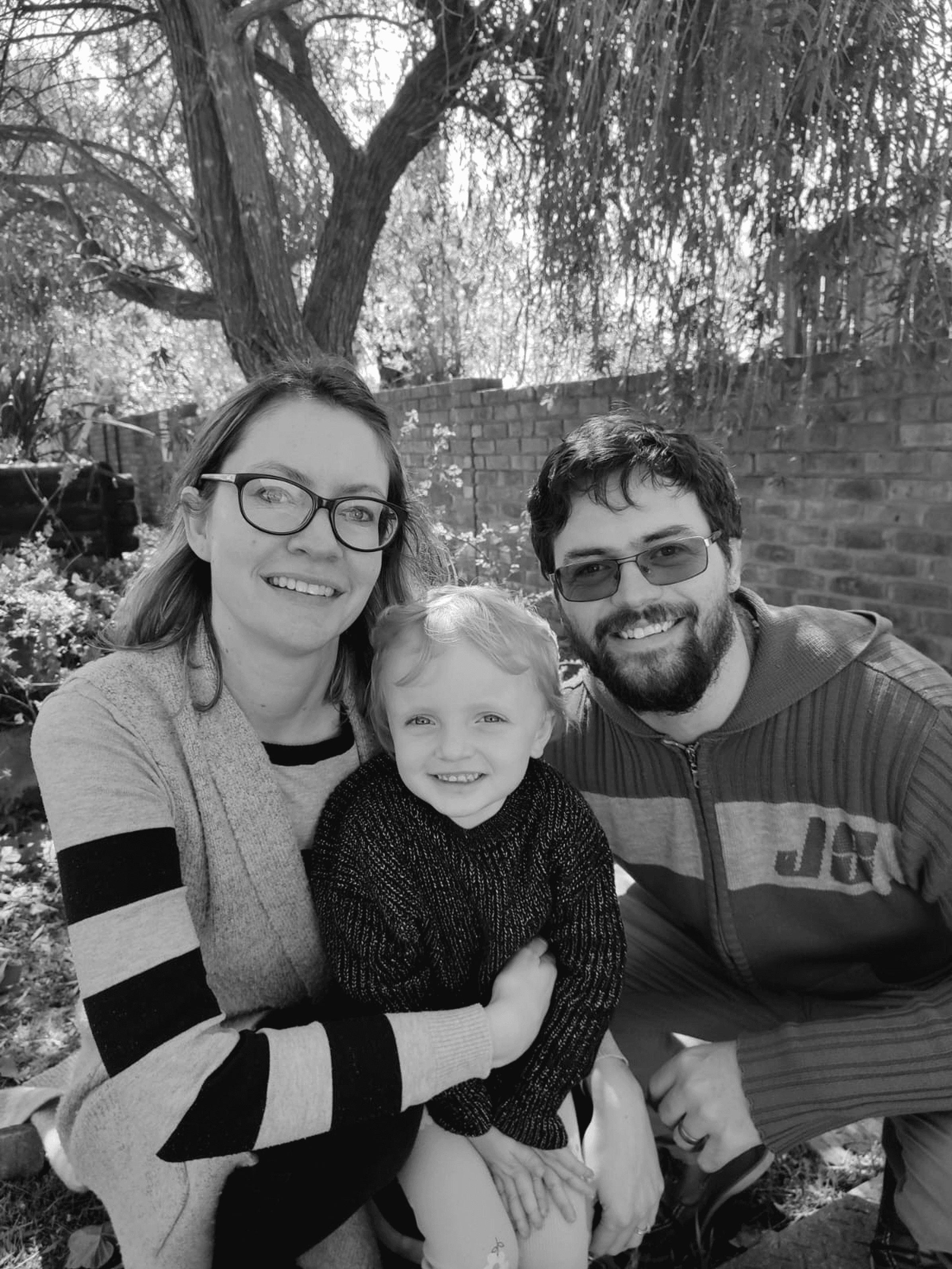 A person stands in a sandstone cave.