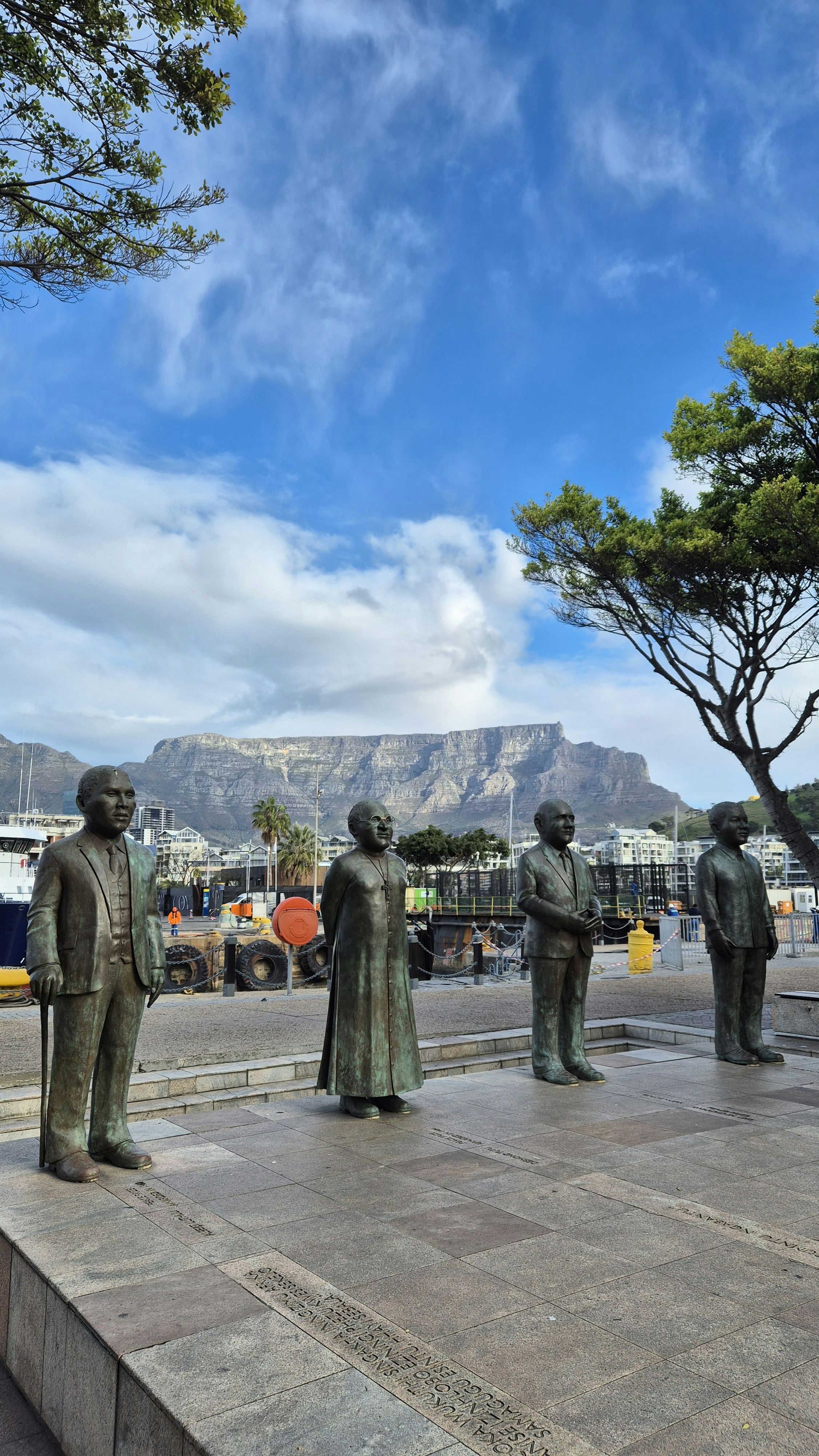 A statue of a group of men standing next to each other
