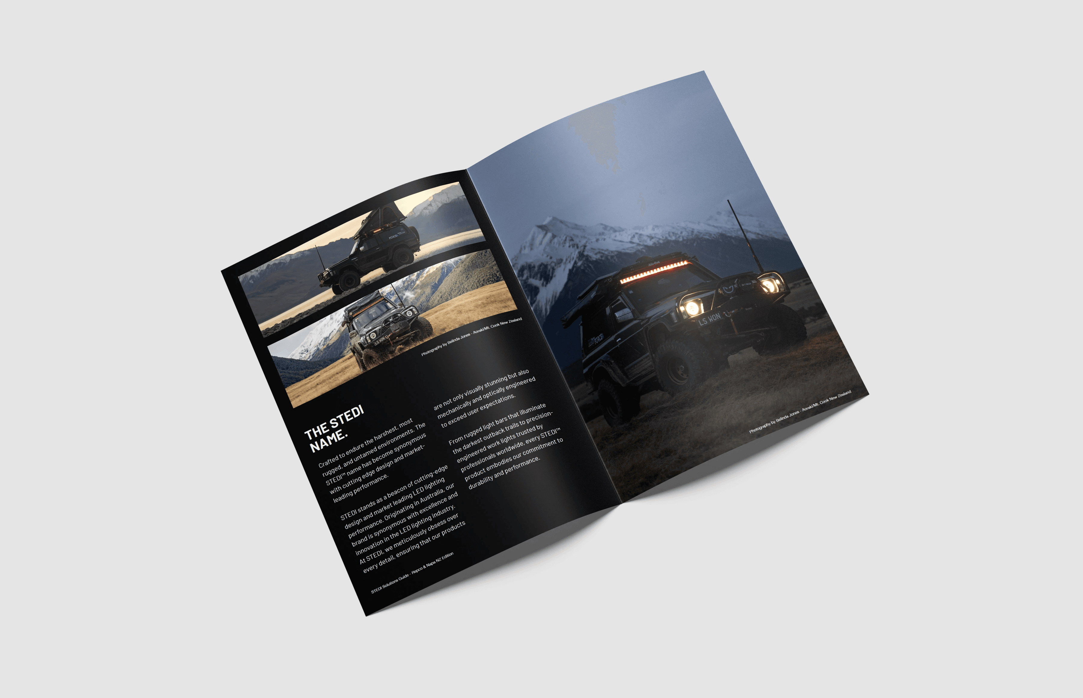 Open book with sunlight and shadows highlighting editorial typography design