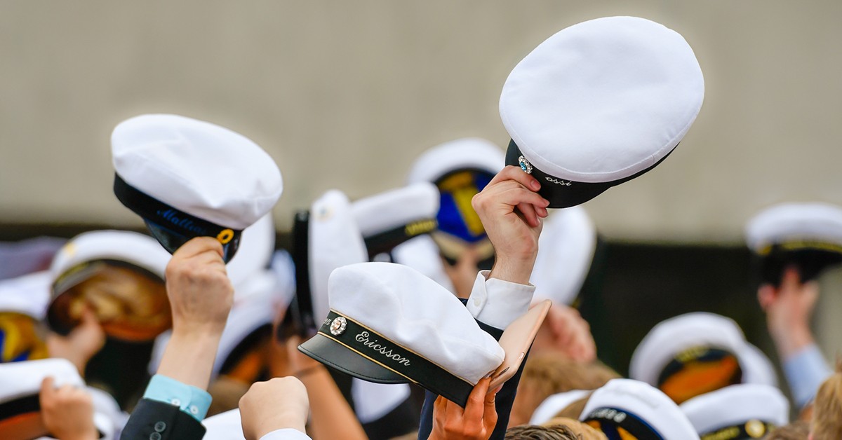 woman in black and white soccer jersey kicking soccer ball on green field during daytime