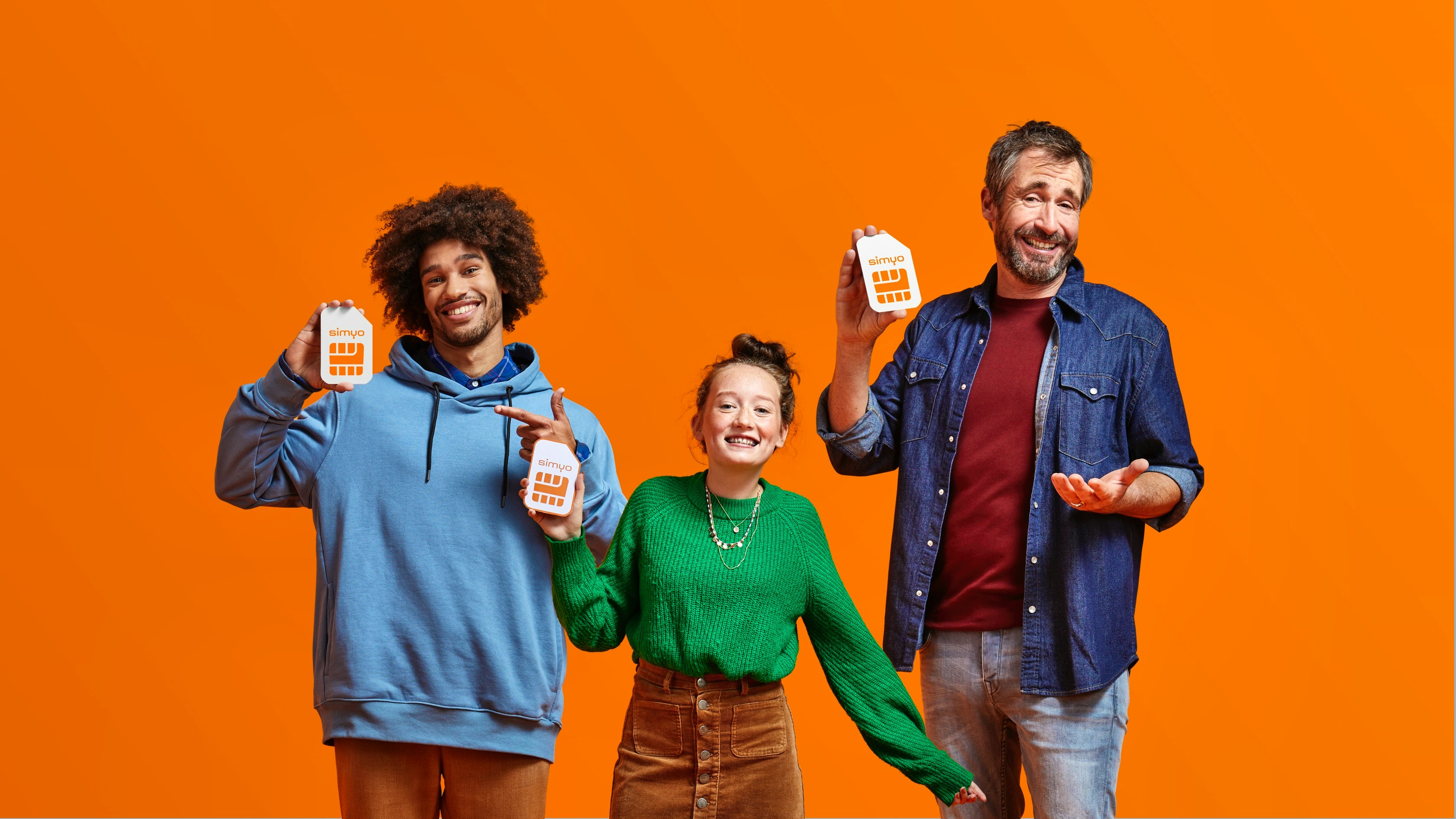 Simyo — three smiling people each holding a Simyo SIM card package against an orange background — Soda Studio case study