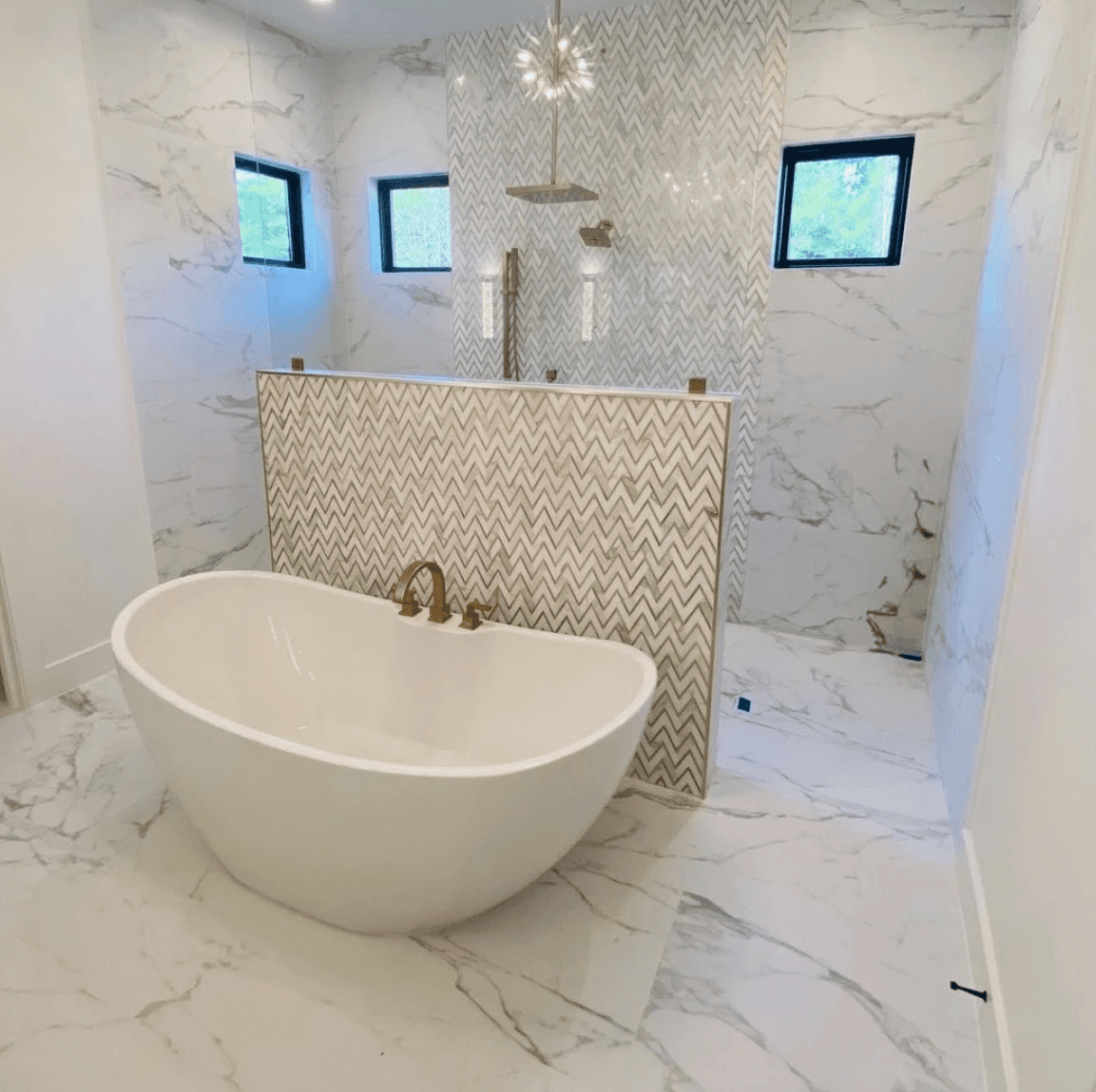 A man sanding a wooden table with a sander