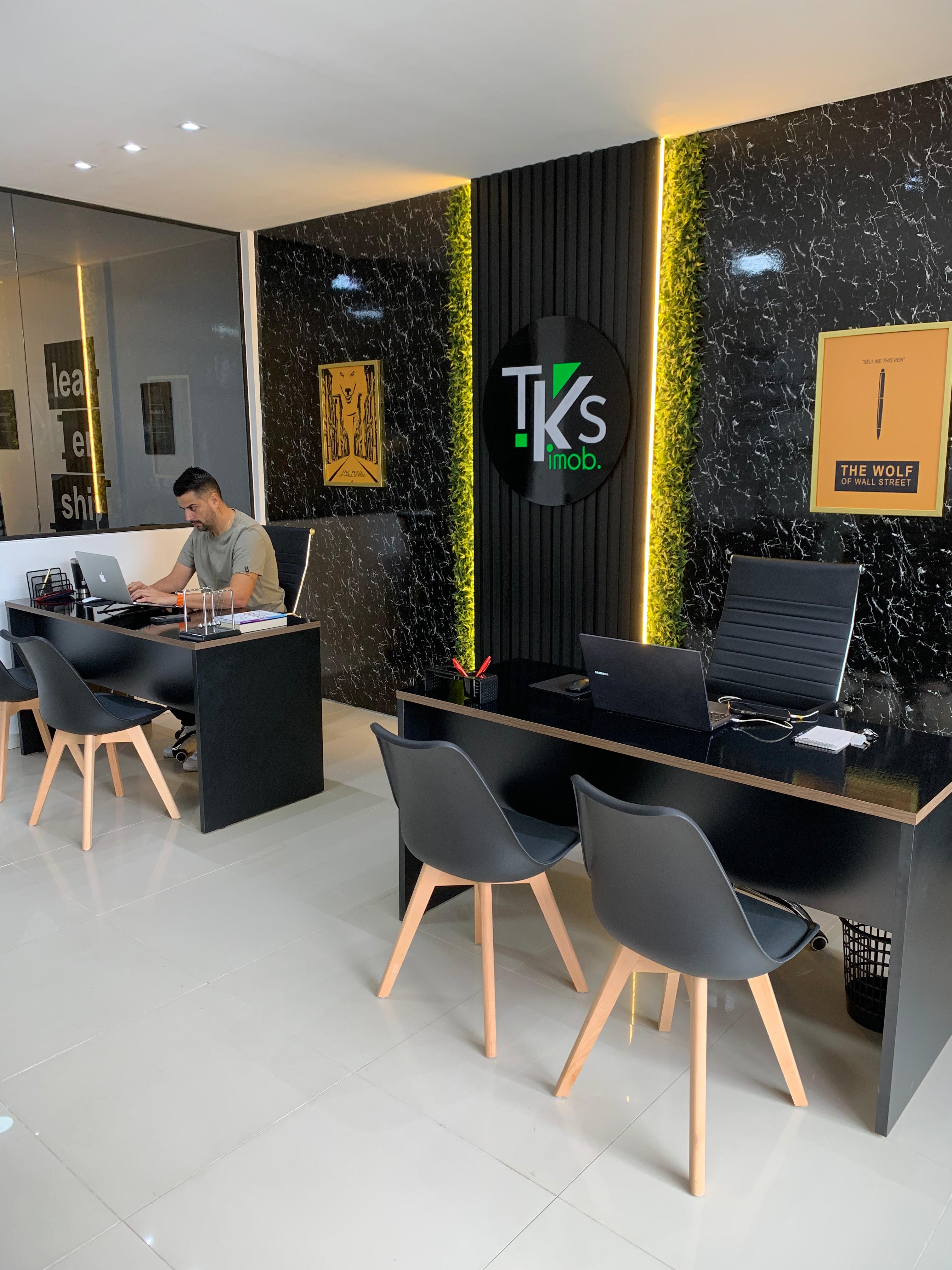 The photo of a skyscrapper and the blue sky as a background