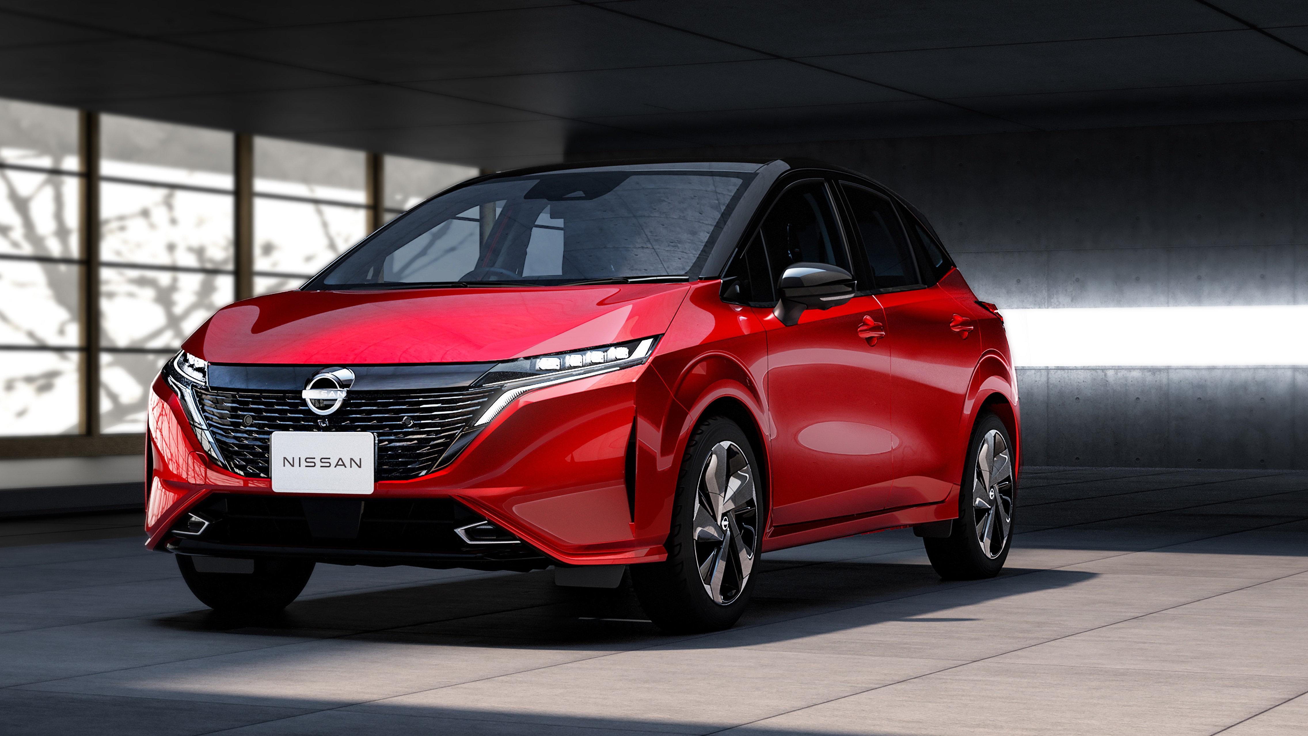 red Nissan Aura exterior