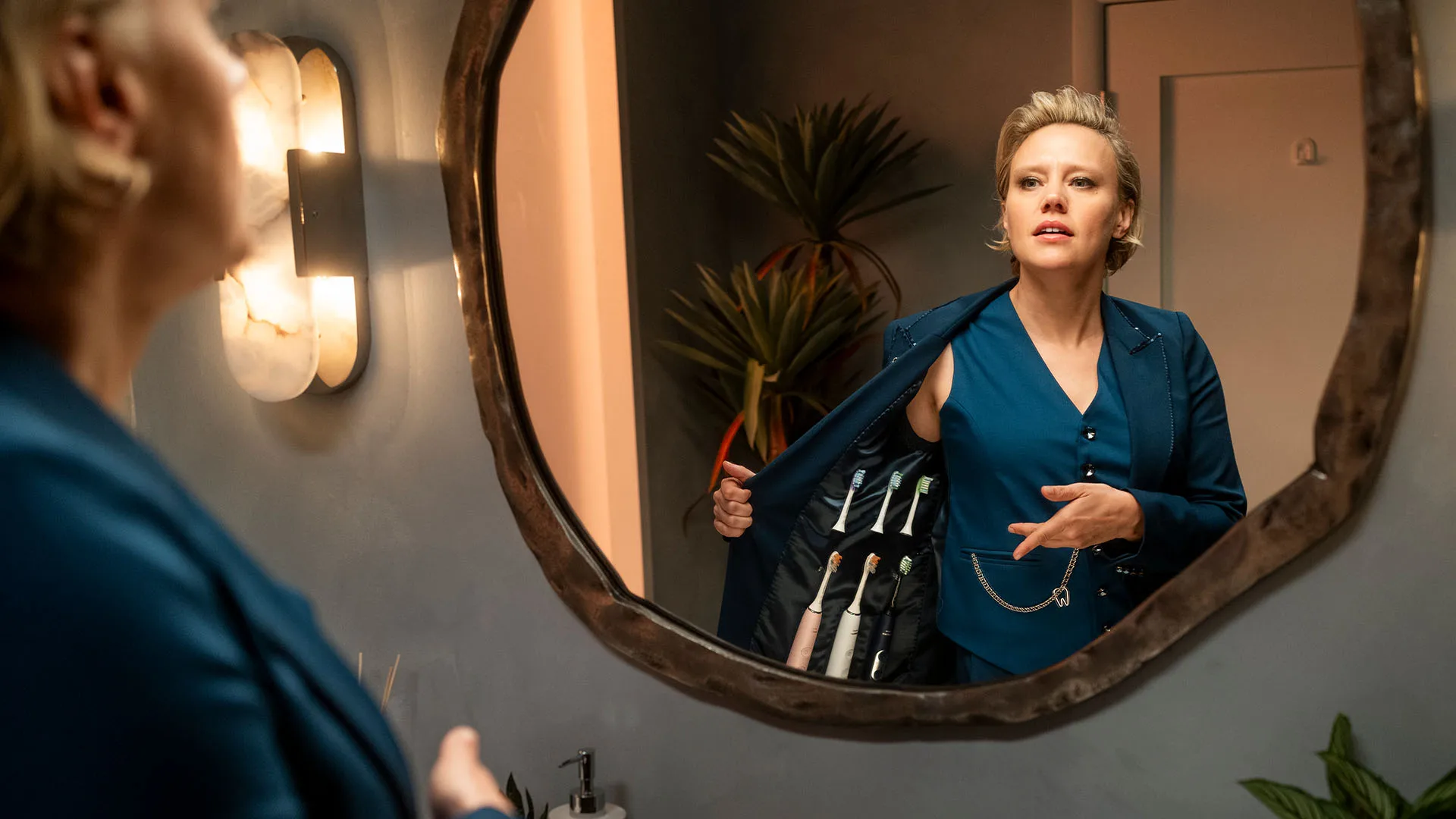 Modern staircase with glass railing and marble wall