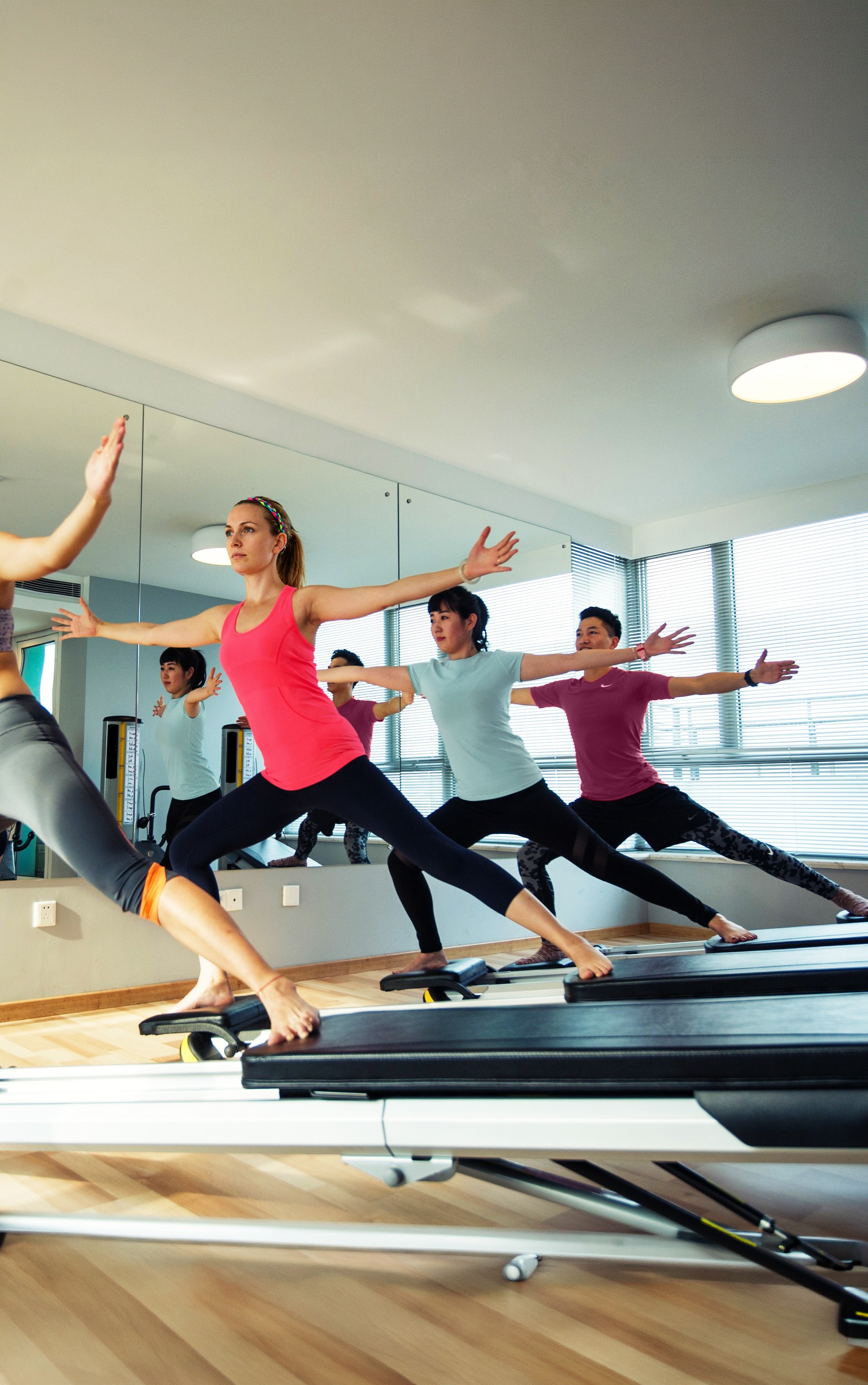 Woman in athletic wear doing high knee exercise